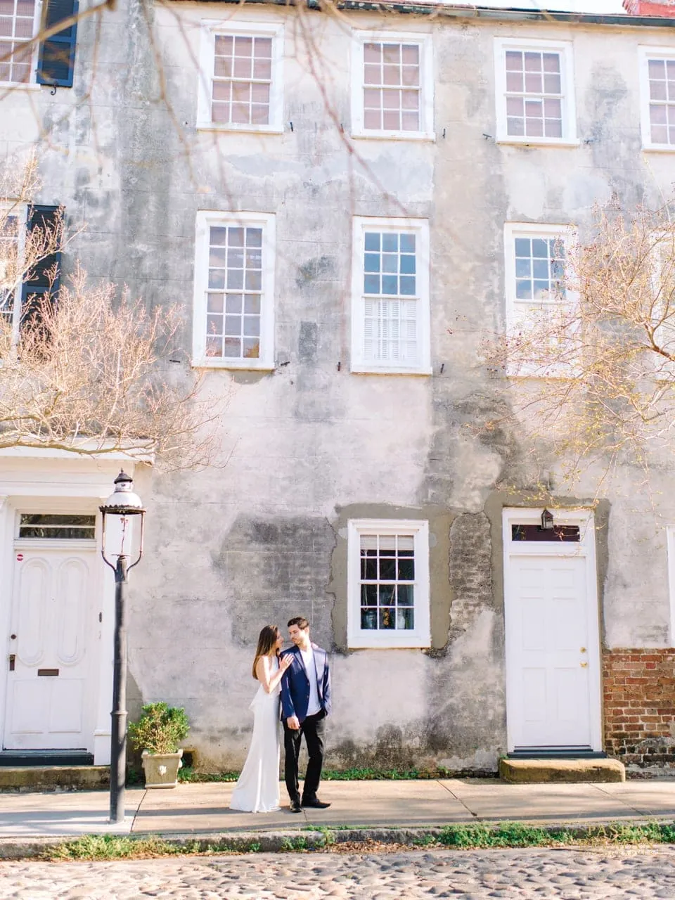 Downtown Charleston engagement photography on cobblestone streets