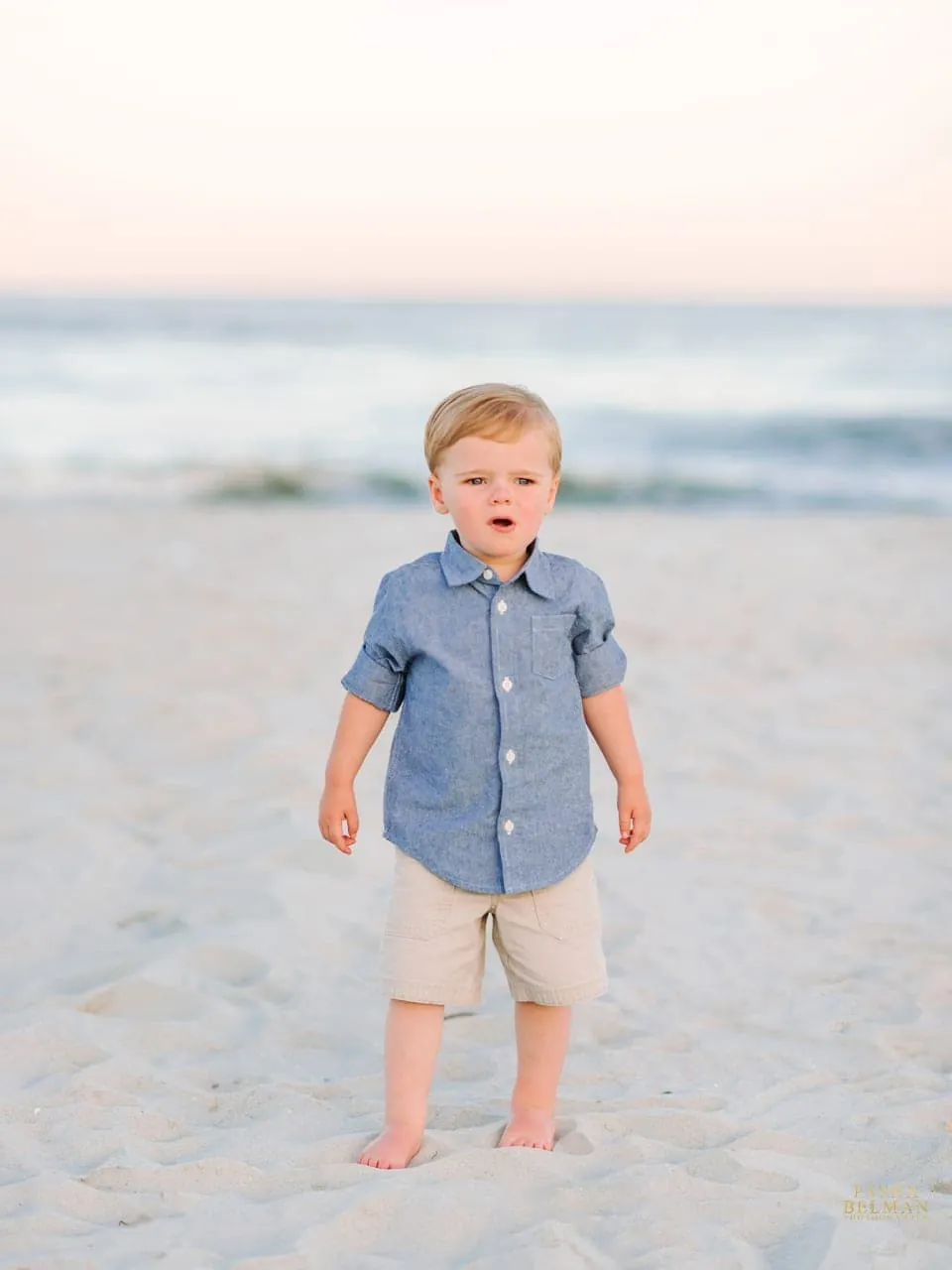 Myrtle Beach family photography session with parents lifting toddler on the beach