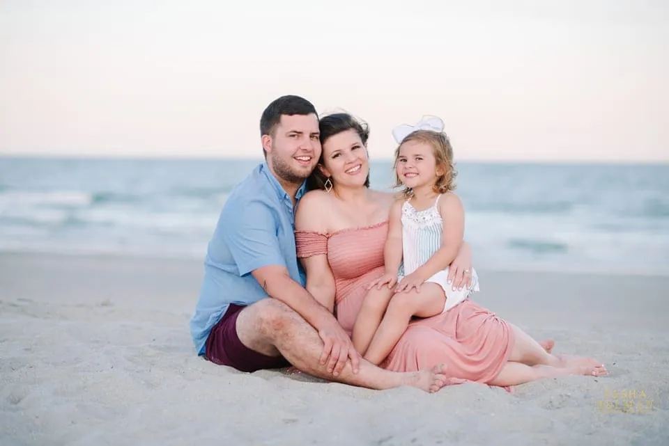 Golden hour family portrait heading toward the beach