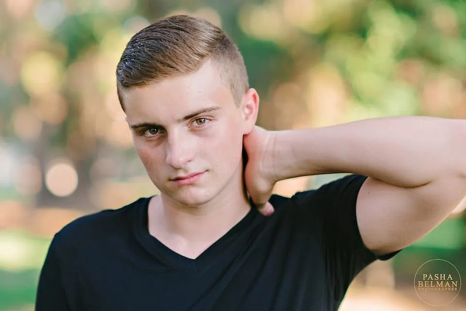 Senior guy portrait with natural greenery backdrop near Myrtle Beach
