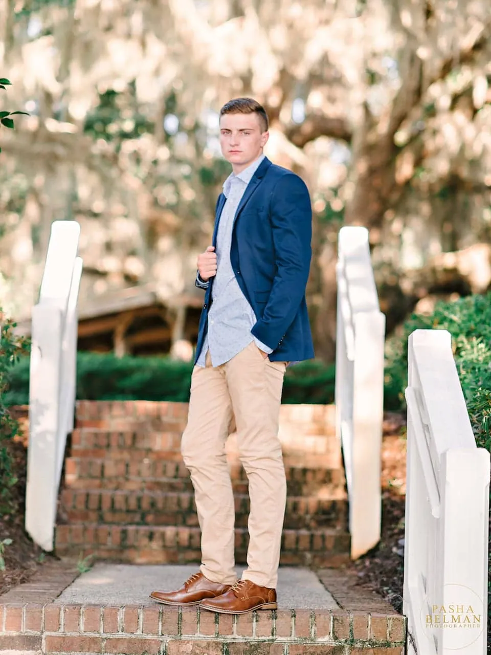 Senior guy relaxed pose under oak trees near Murrells Inlet by Pasha Belman