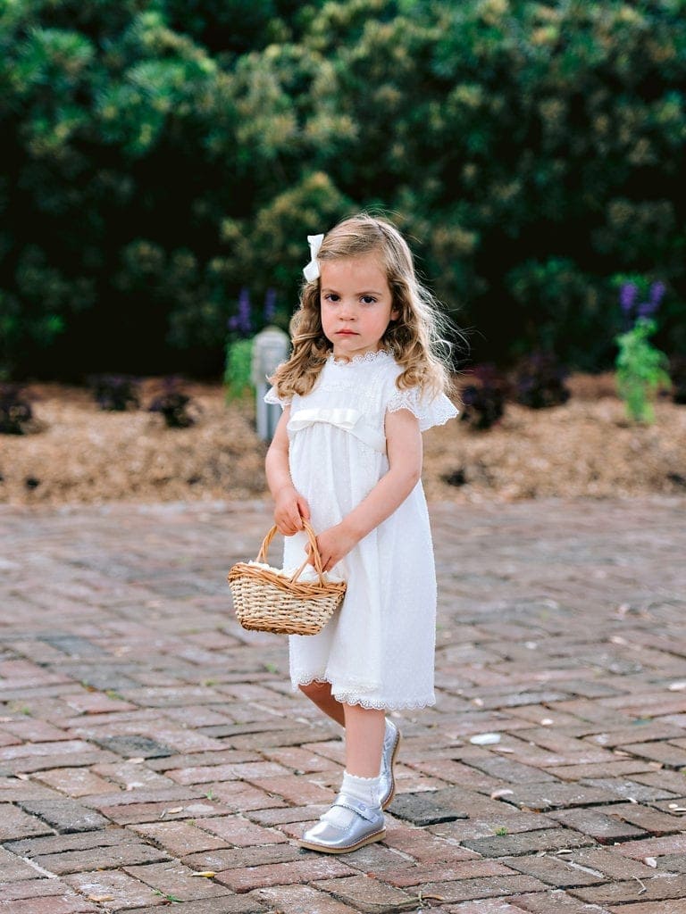 Flower Girls holding basket at wedding in Debordieu 