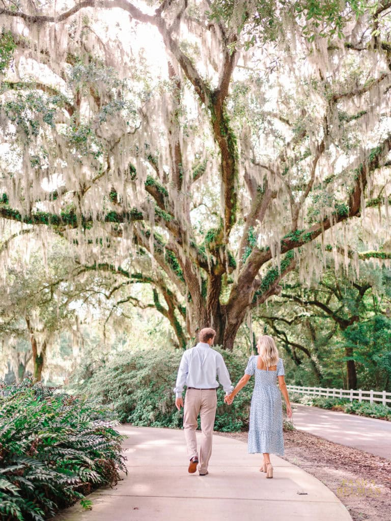 Couple engagement photos at Caledonia Golf and Fish Club Pawleys Island South Carolina surrounded by Southern greenery