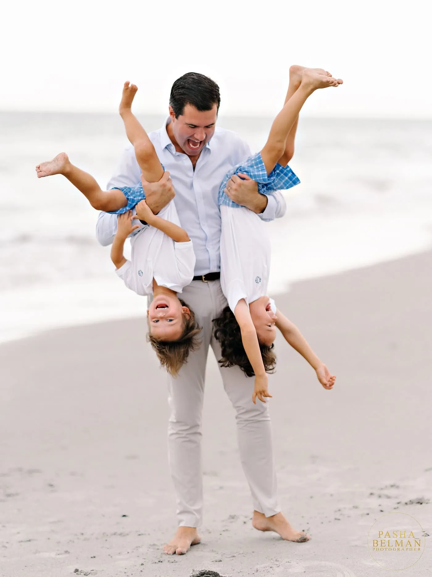 Men and boys styled in neutral beach outfits for fall family photo session