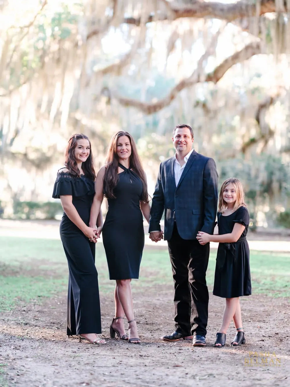 Family portrait photographed beneath the oak trees at Wachesaw in Murrells Inlet