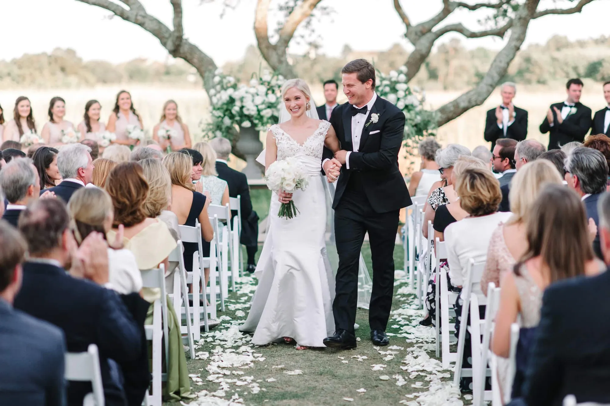 Wedding ceremony under oak trees at Debordieu Colony Club South Carolina