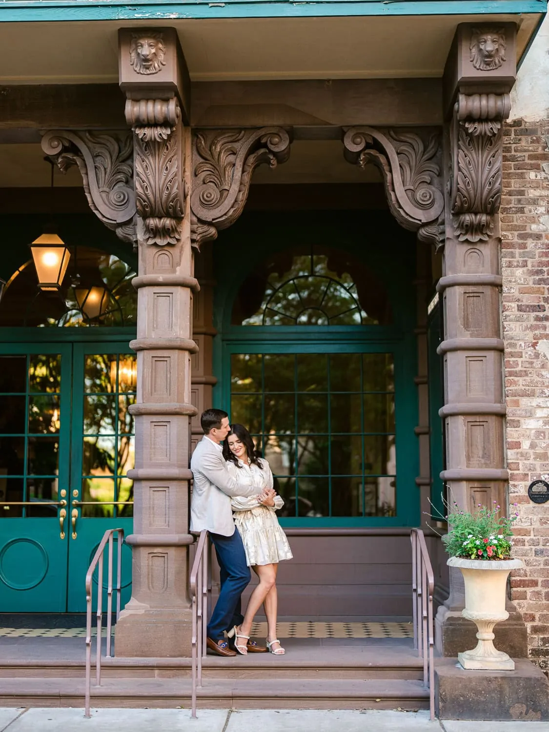 Couple exploring historic downtown Charleston during their engagement photo session