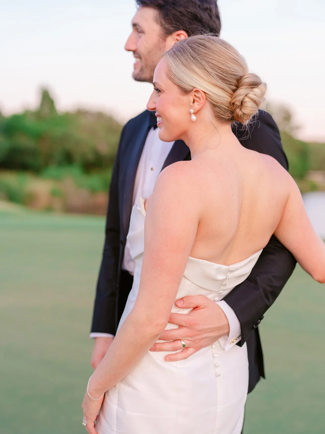 Elegant bride and groom portrait at sunset, showcasing wedding photography with vibrant colors and romantic atmosphere.