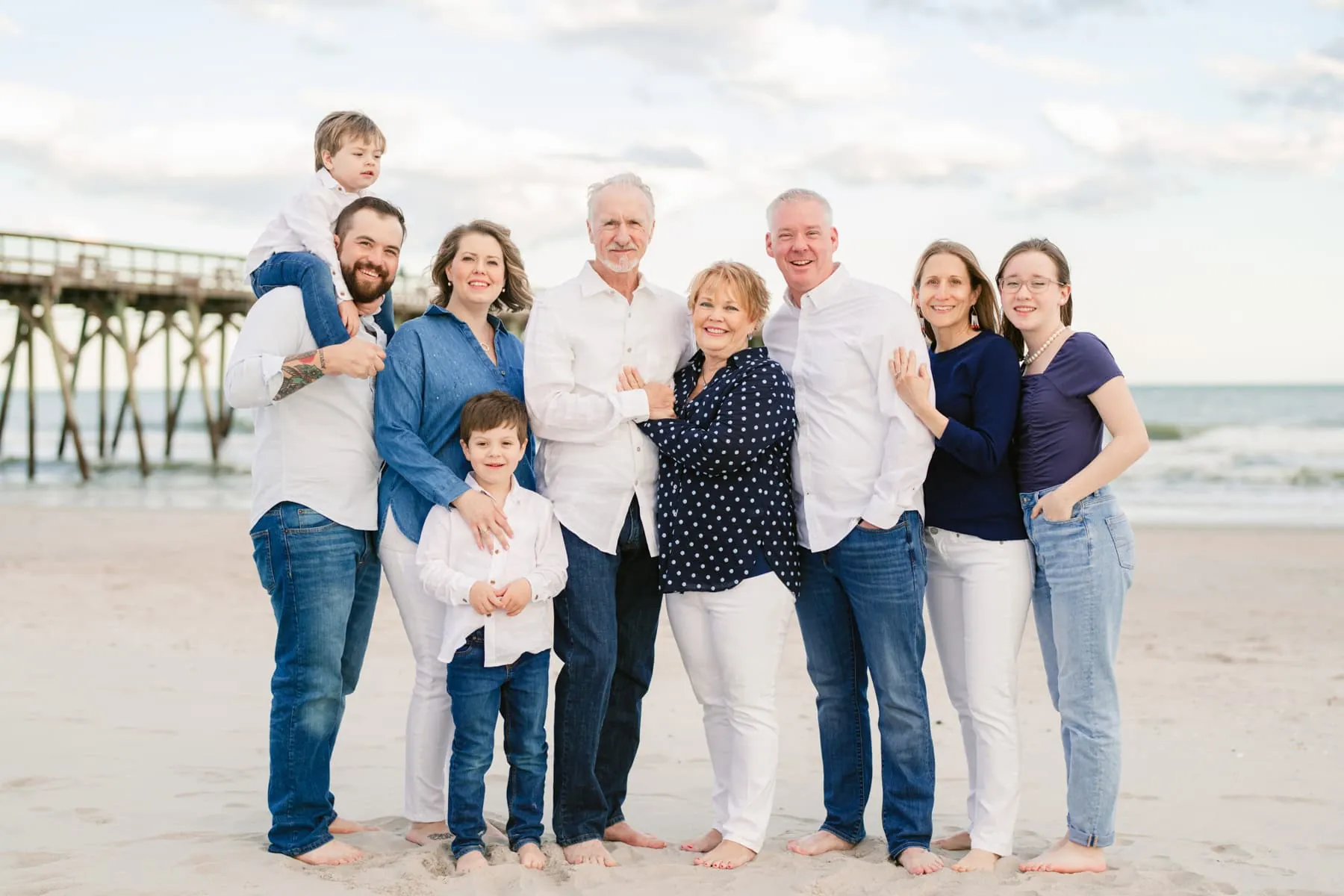 Family walking together along the Myrtle Beach shoreline at golden hour