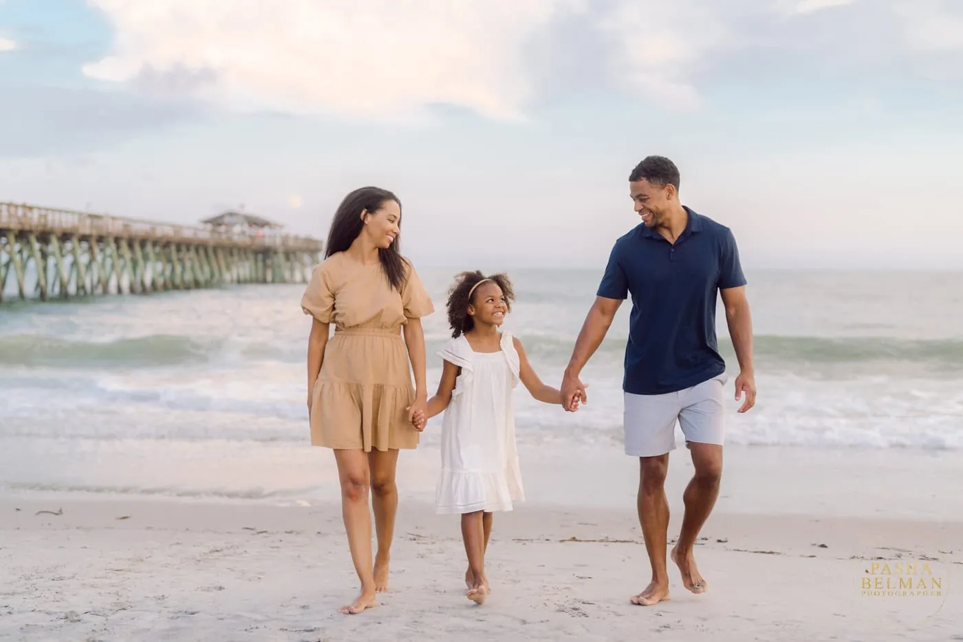 Navy and tan family beach photo outfits photographed during golden hour