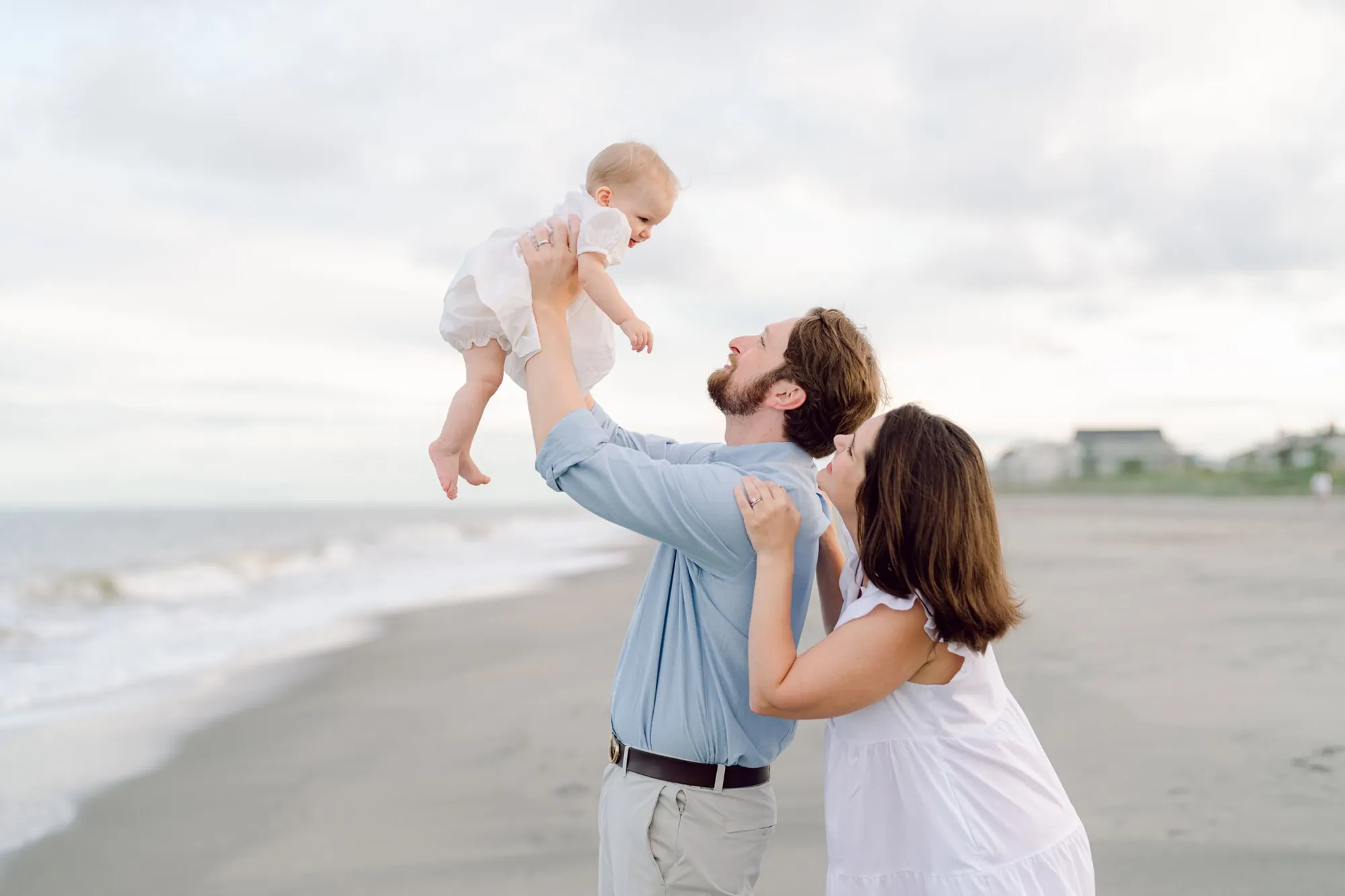 Large family group photo on Litchfield Beach SC photographed by Pasha Belman during a sunset beach portrait session