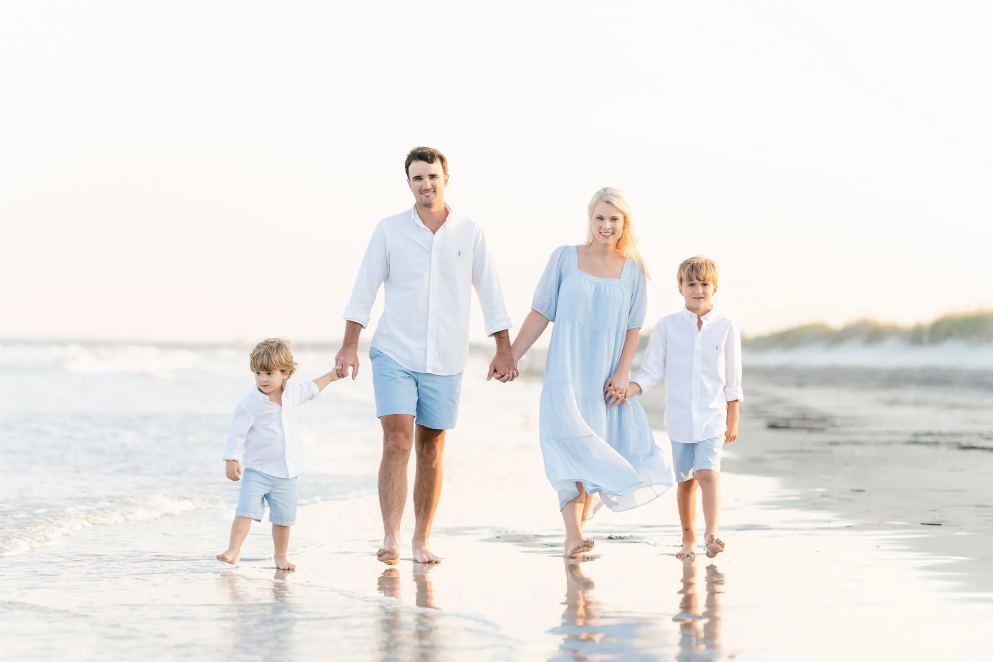 Alexander family walking together along the beach in Myrtle Beach