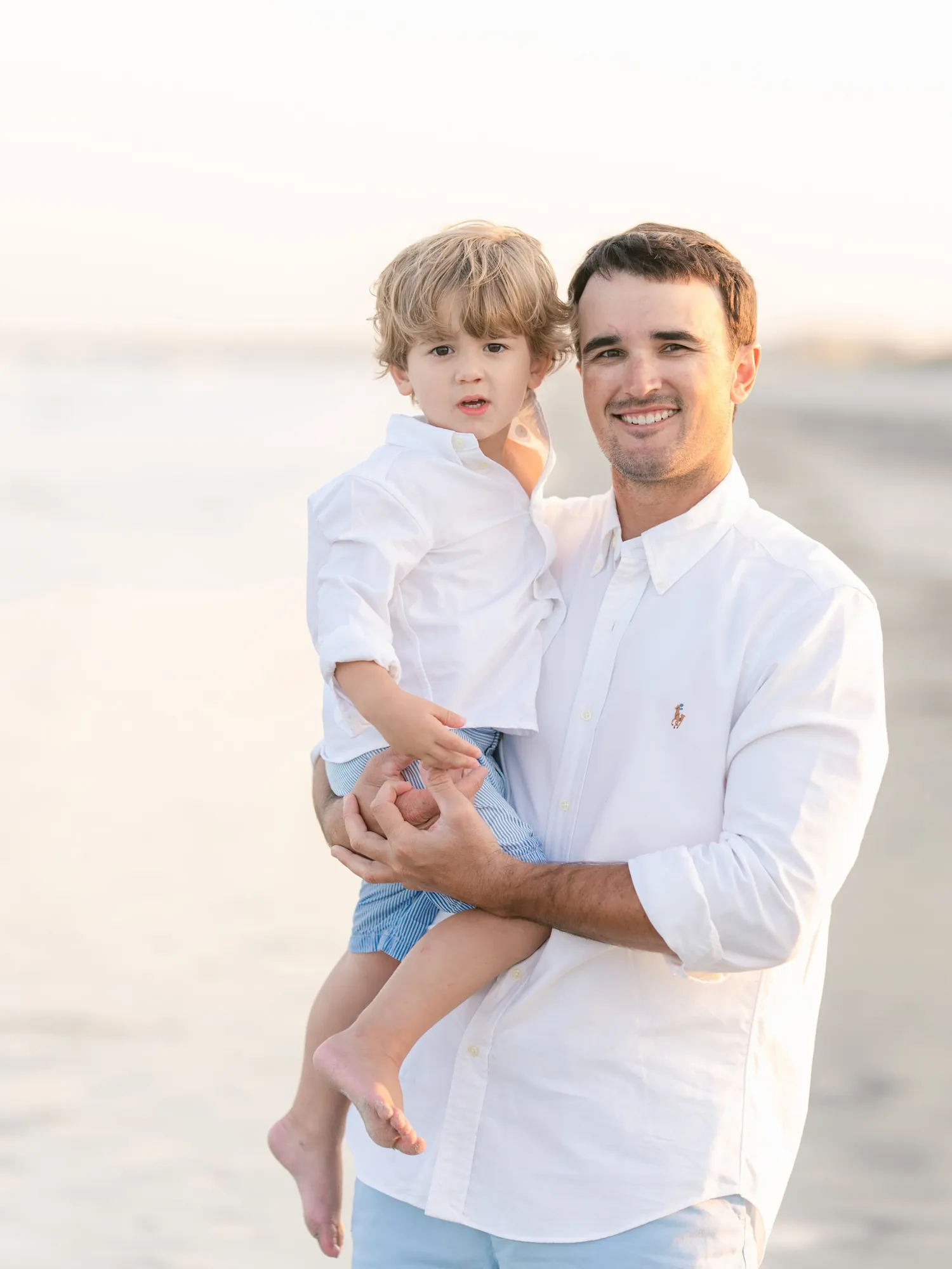 Natural moment between members of the Alexander family during their beach photos