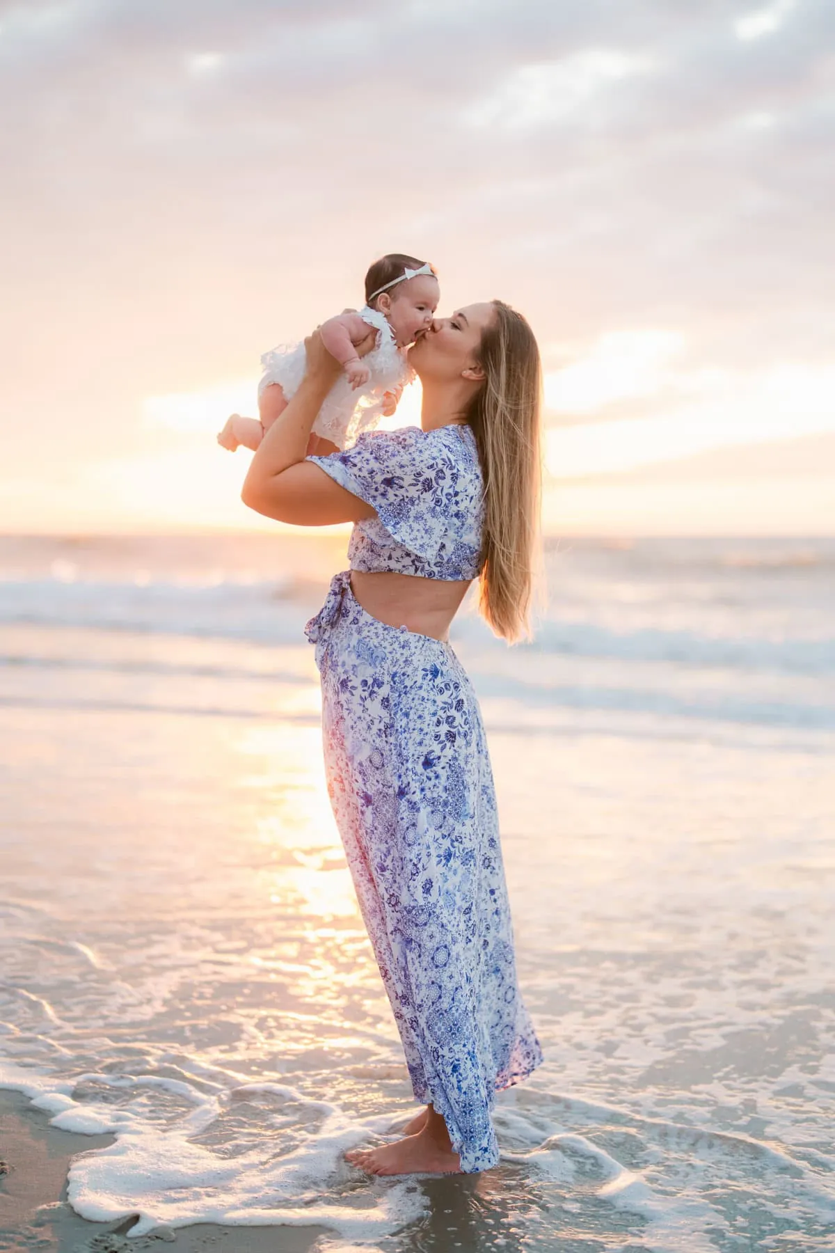 Flowing dresses and coordinated outfits for women and girls during sunrise family beach photo session