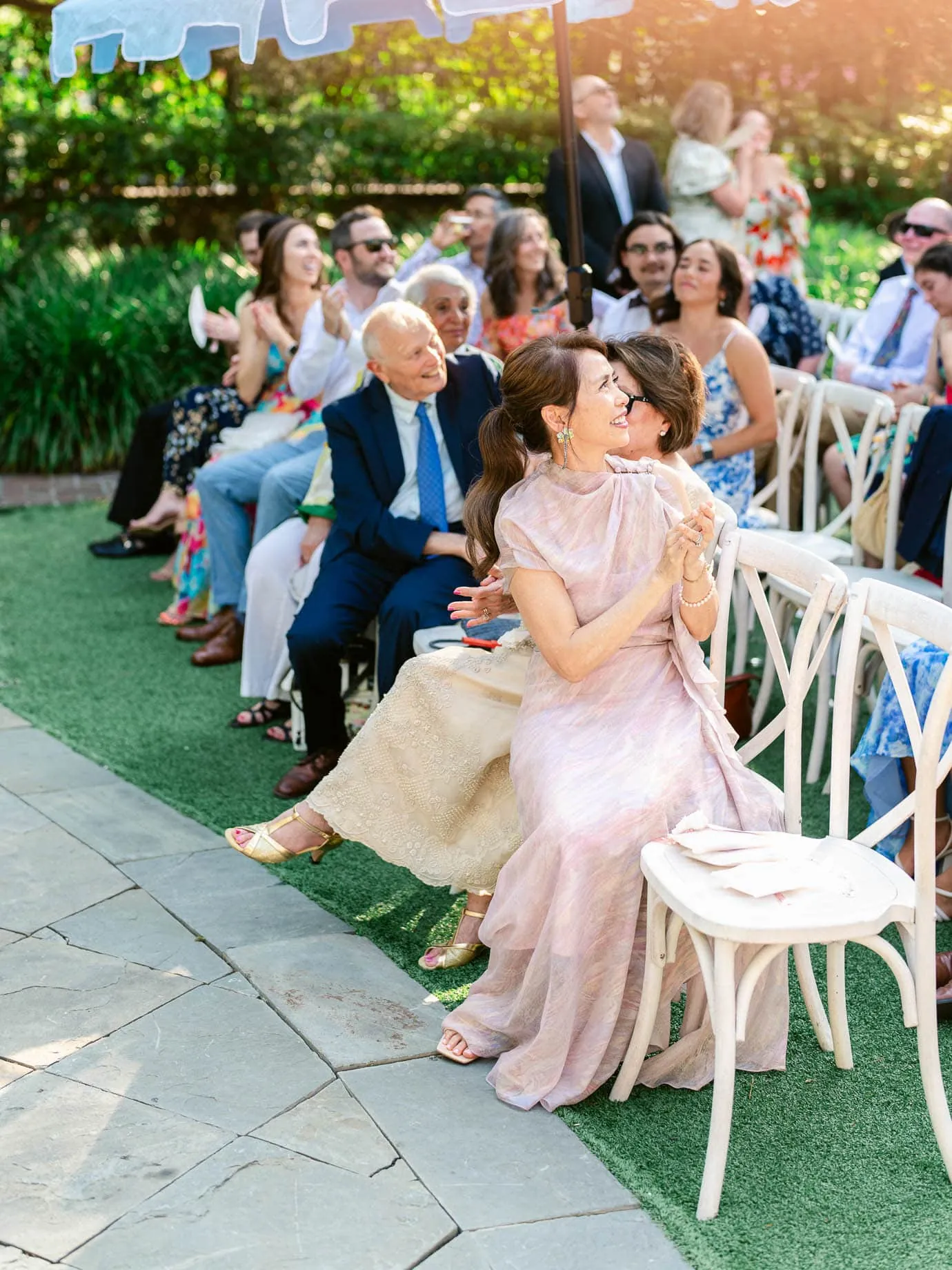 Bride and groom beneath the pergola at the William Aiken House