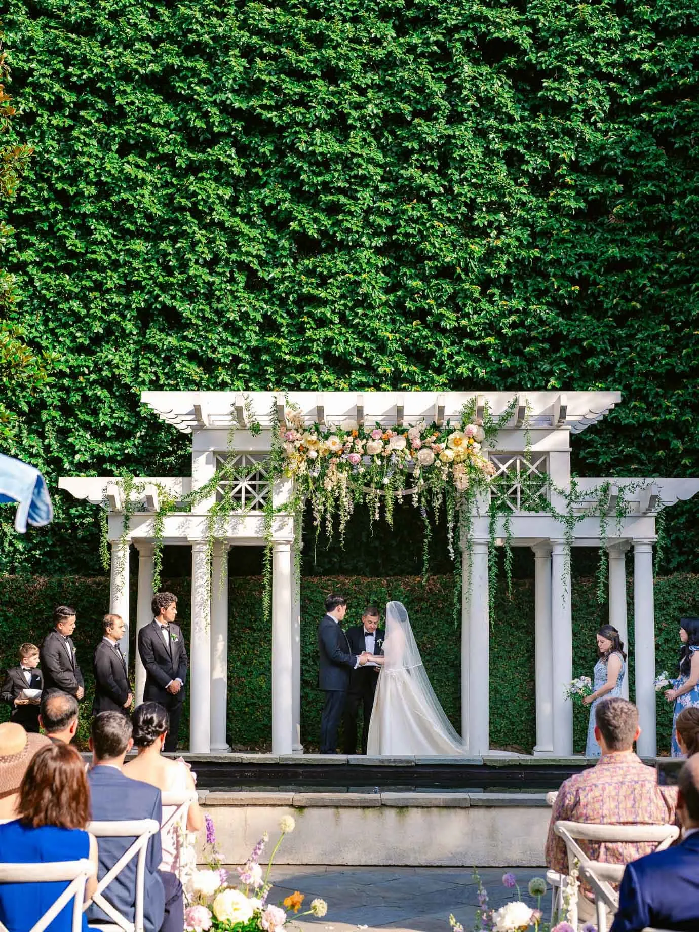 Couple exchanging vows under the centuries old magnolia tree