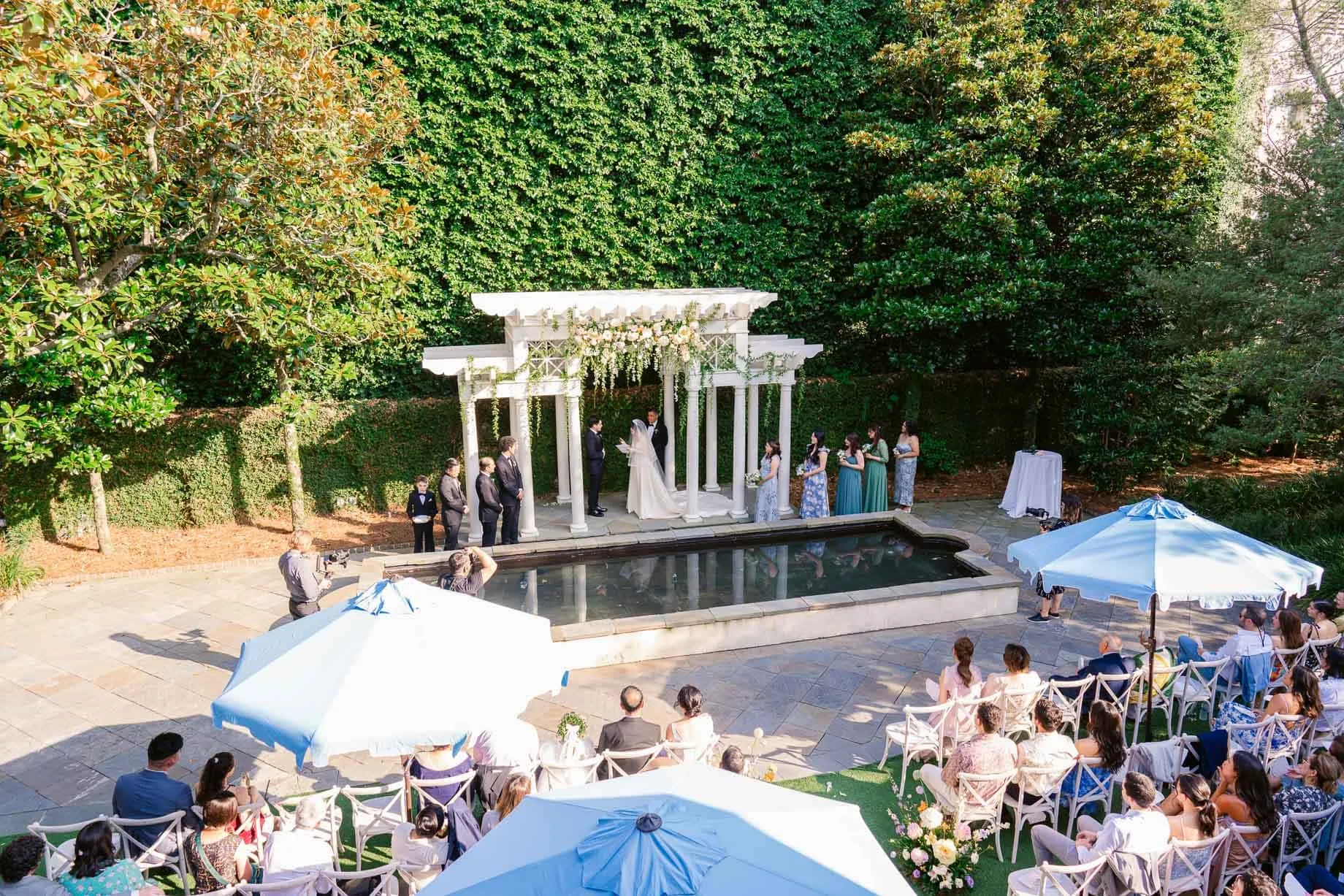 Guests seated for a courtyard ceremony at the William Aiken House