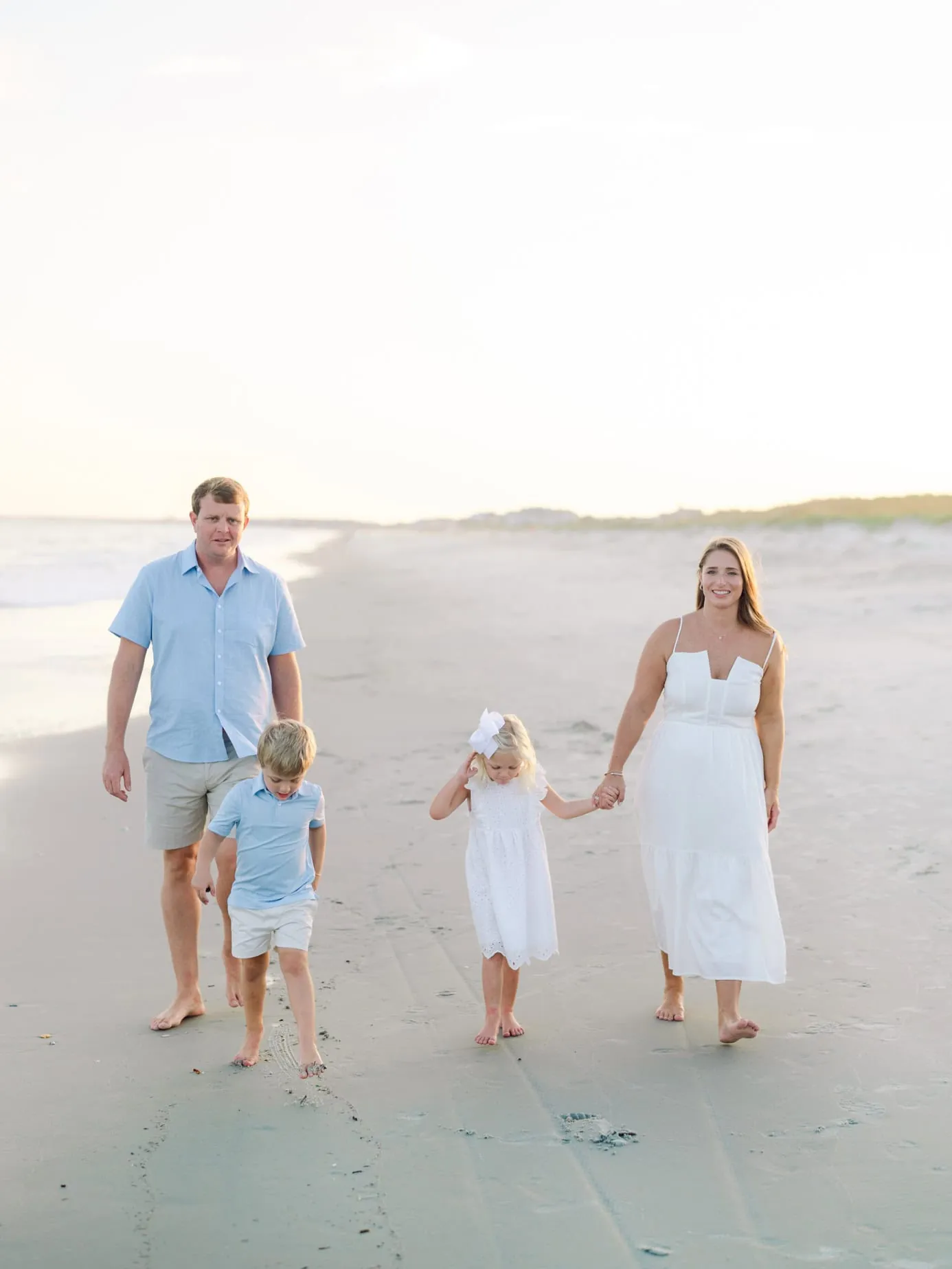 Myrtle Beach South Carolina family photography by Pasha Belman showing a family on the beach at sunset