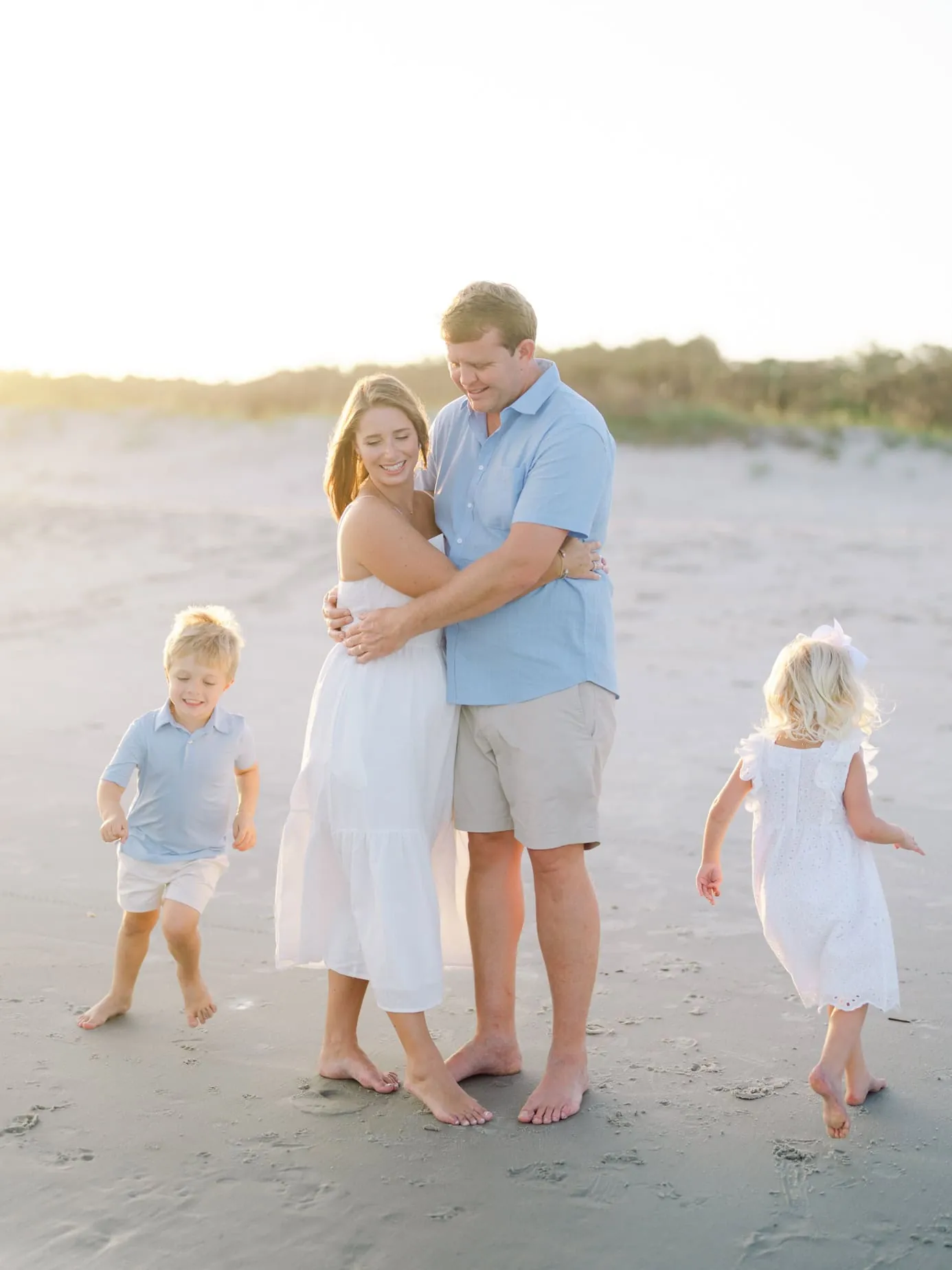 Family session photographed at sunset on Surfside Beach South Carolina by Pasha Belman Photography