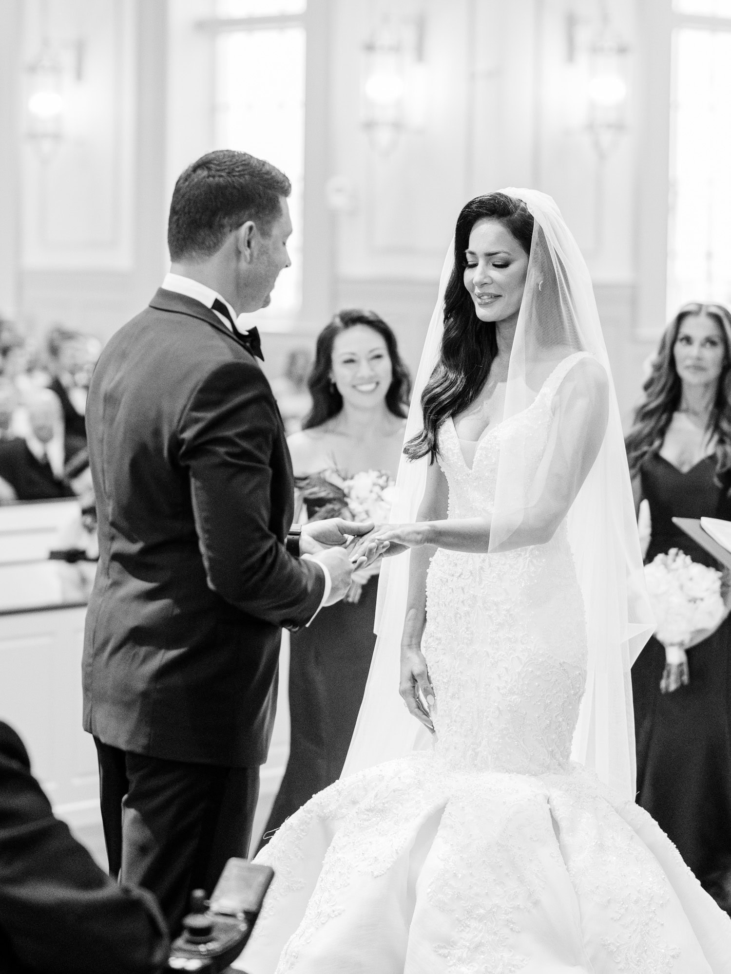 Bride and groom walking hand-in-hand during their Dunes Golf Club wedding

