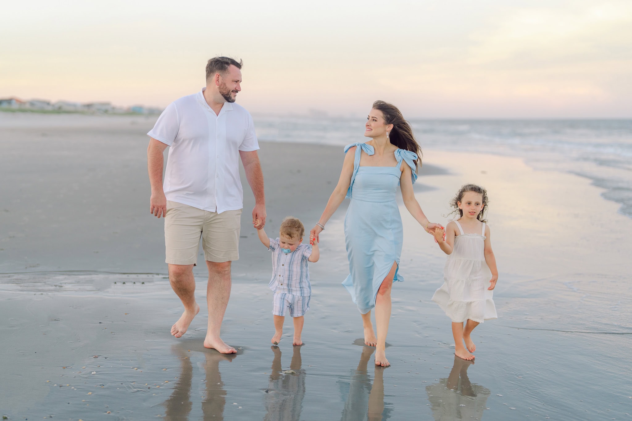 Family beach portrait session in Myrtle Beach SC with soft Carolina light on the shoreline
