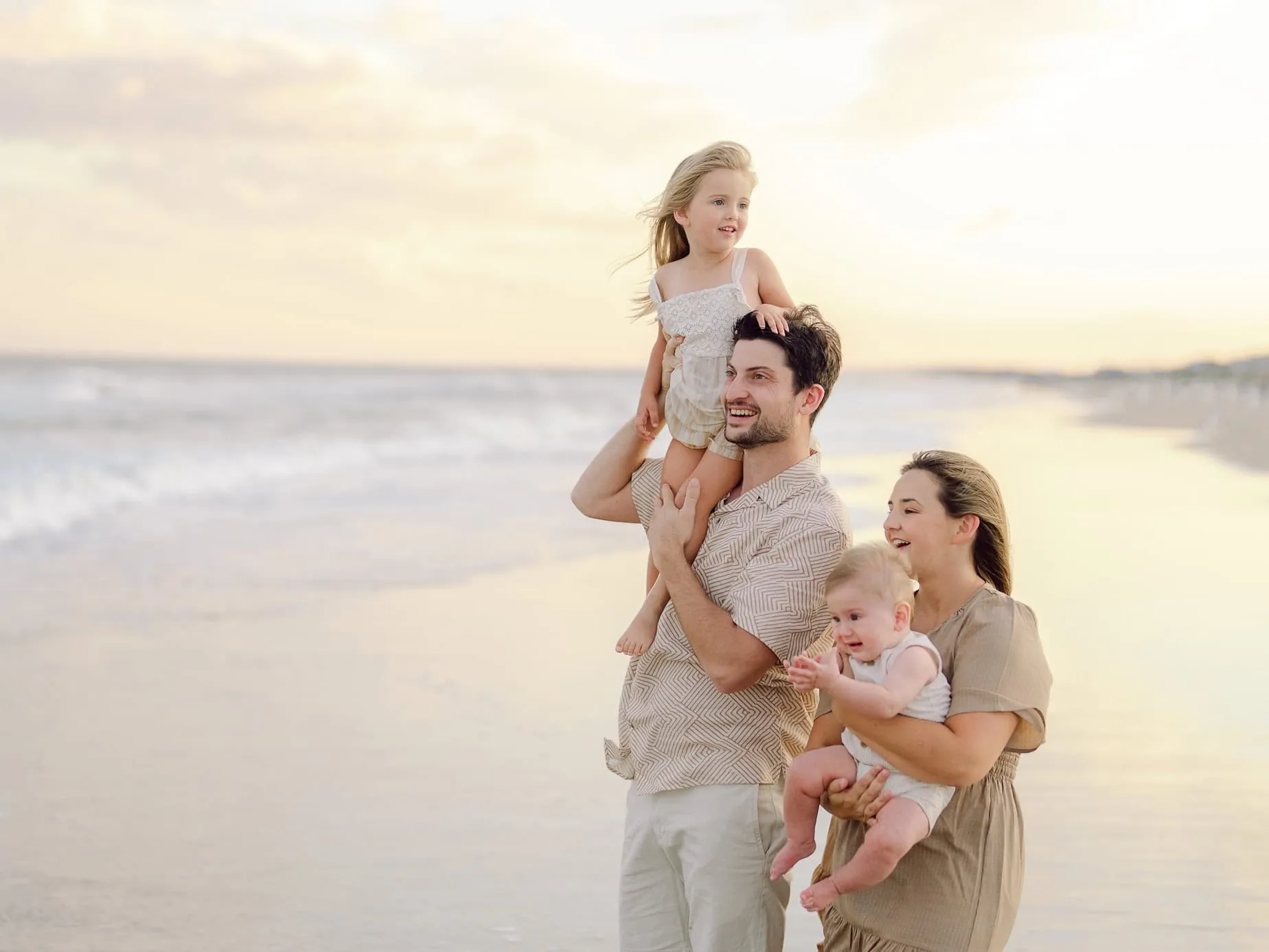 Candid family beach portrait in North Myrtle Beach with natural movement and connection