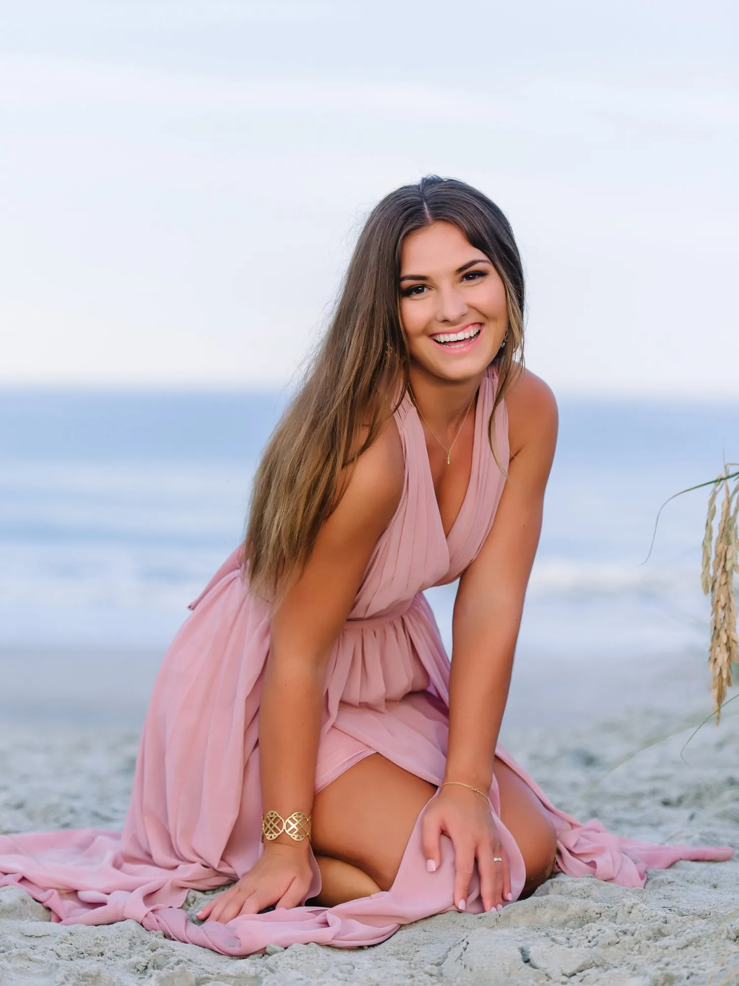 Creative Myrtle Beach senior portrait featuring confident pose and clean coastal background by Pasha Belman Photography