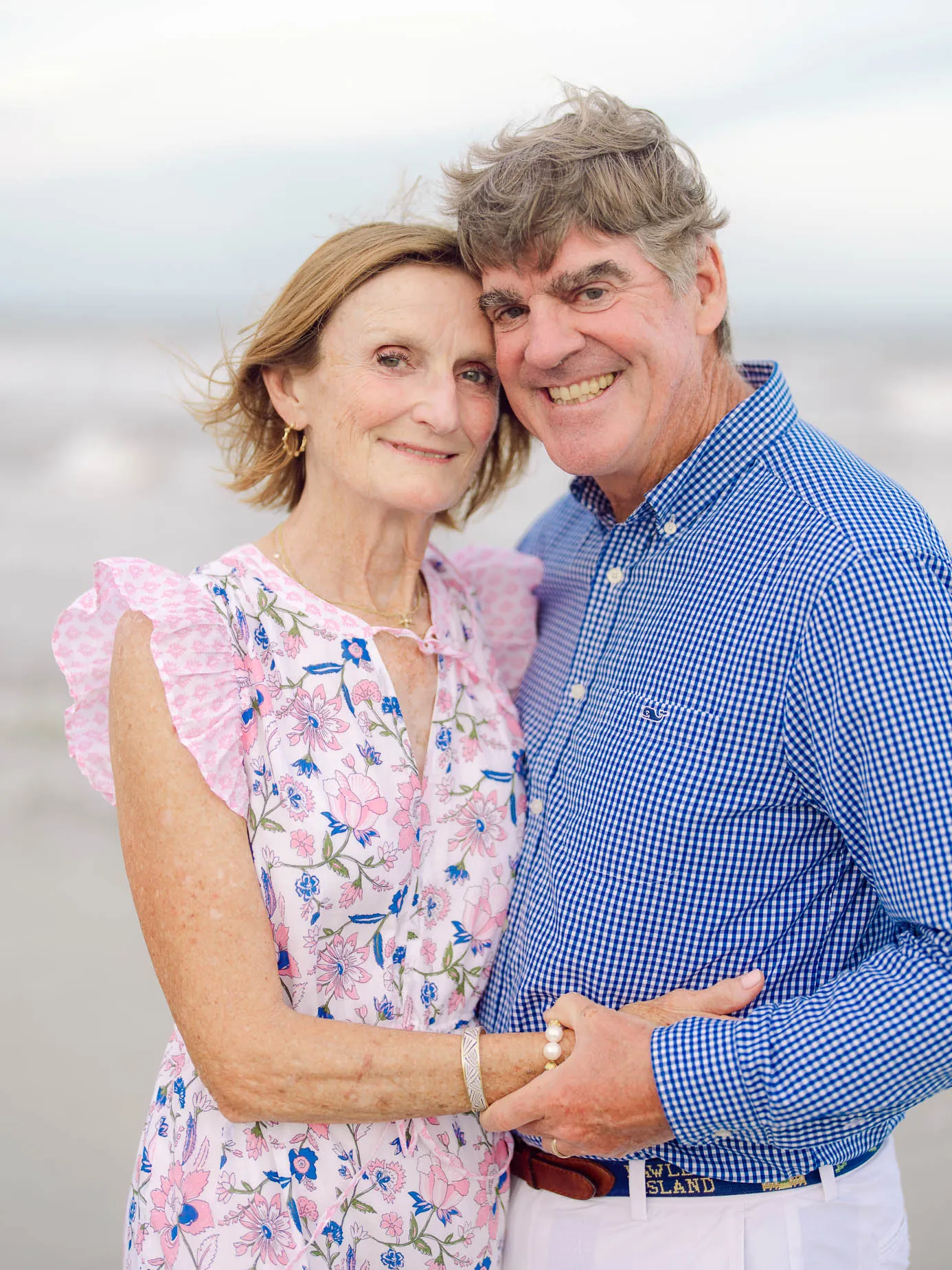 Grandparents photographed together during a multigenerational family beach session