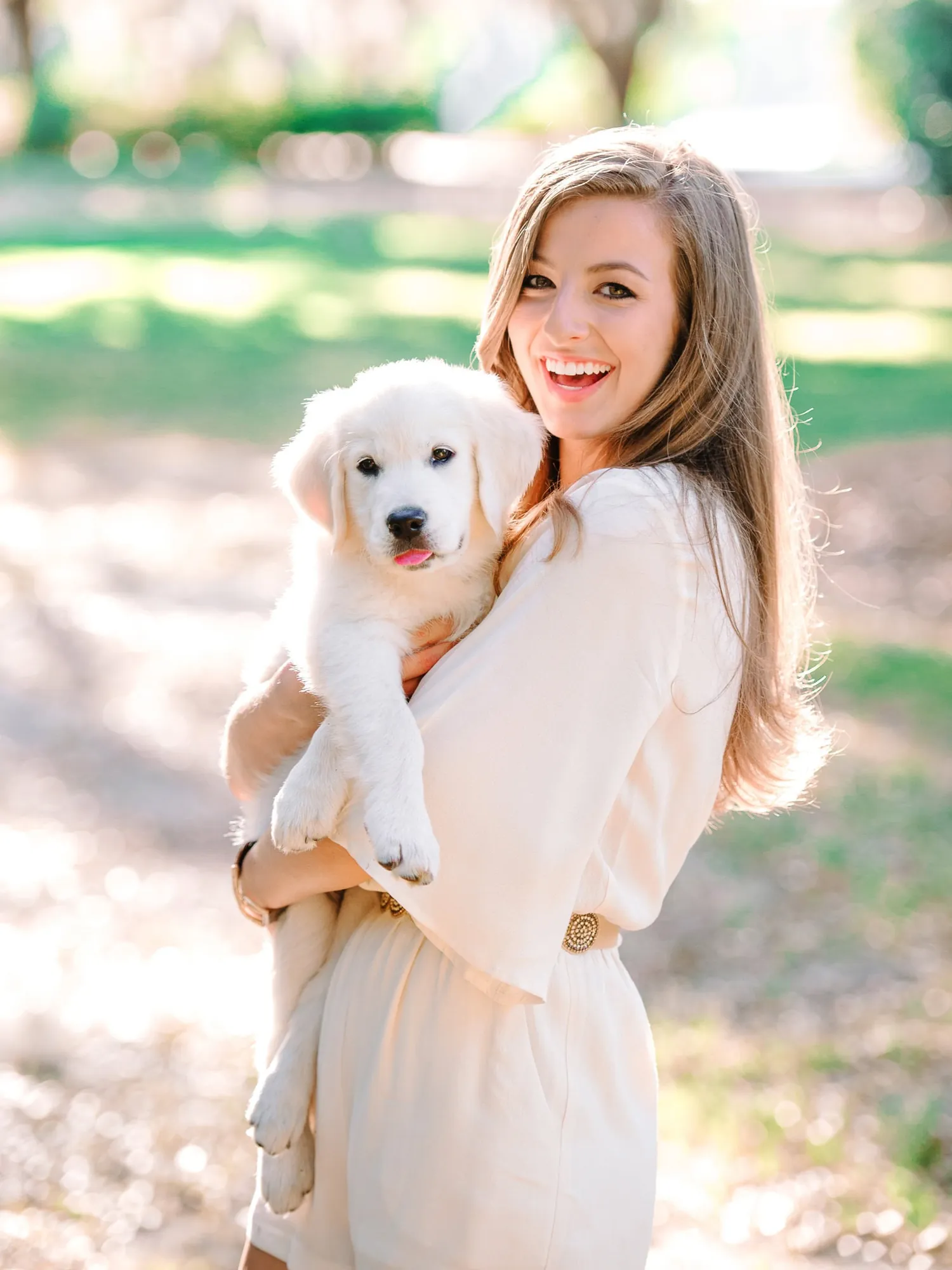 Myrtle Beach senior portrait with dog showing natural interaction and candid emotion photographed by Pasha Belman Photography