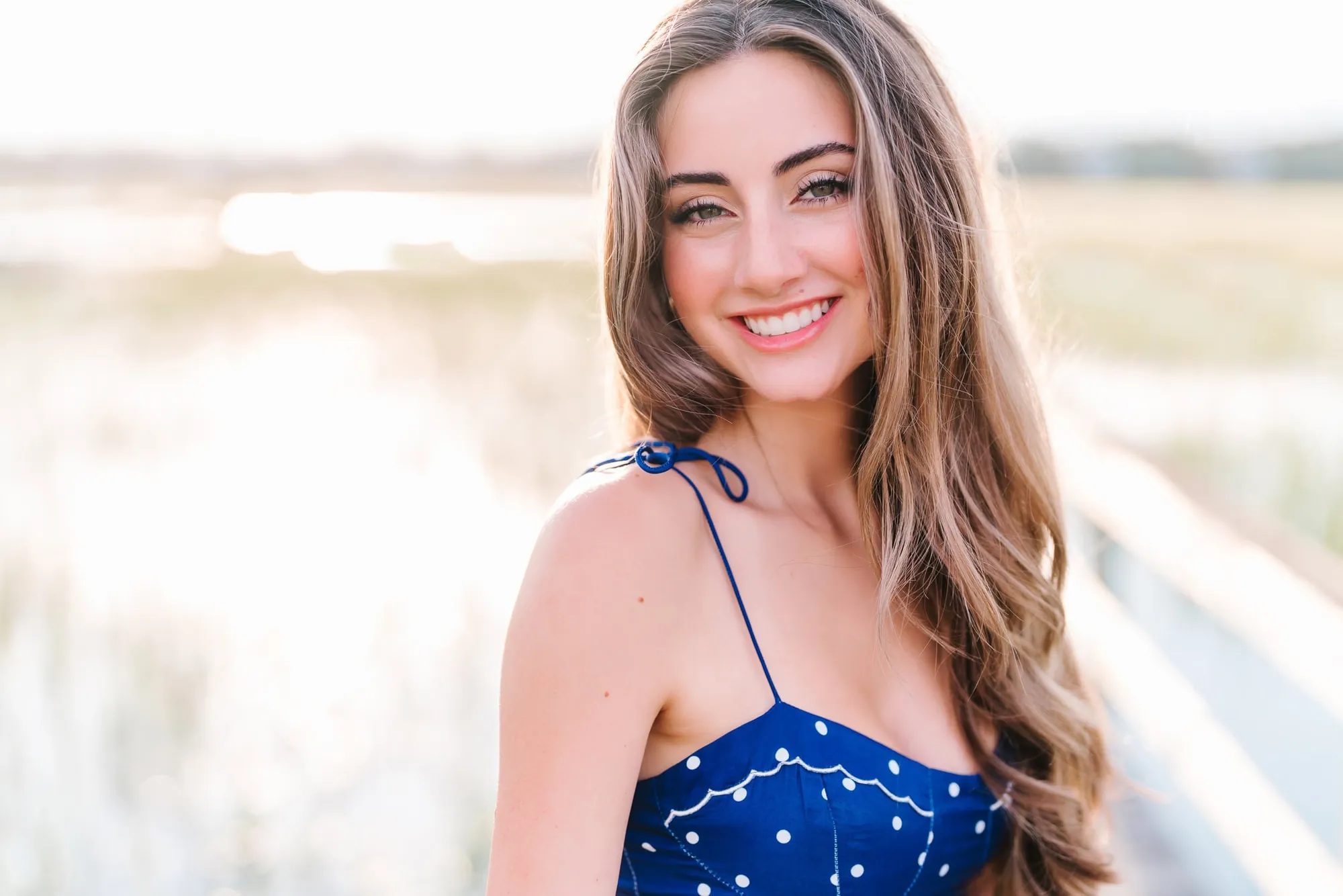 Timeless Myrtle Beach senior portrait photographed in natural light with relaxed posture by Pasha Belman Photography