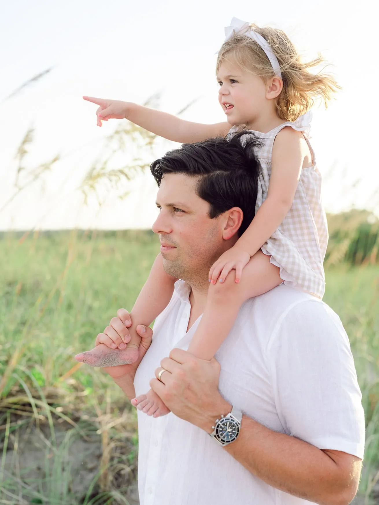 Family dressed in soft neutral tones together at Litchfield Beach