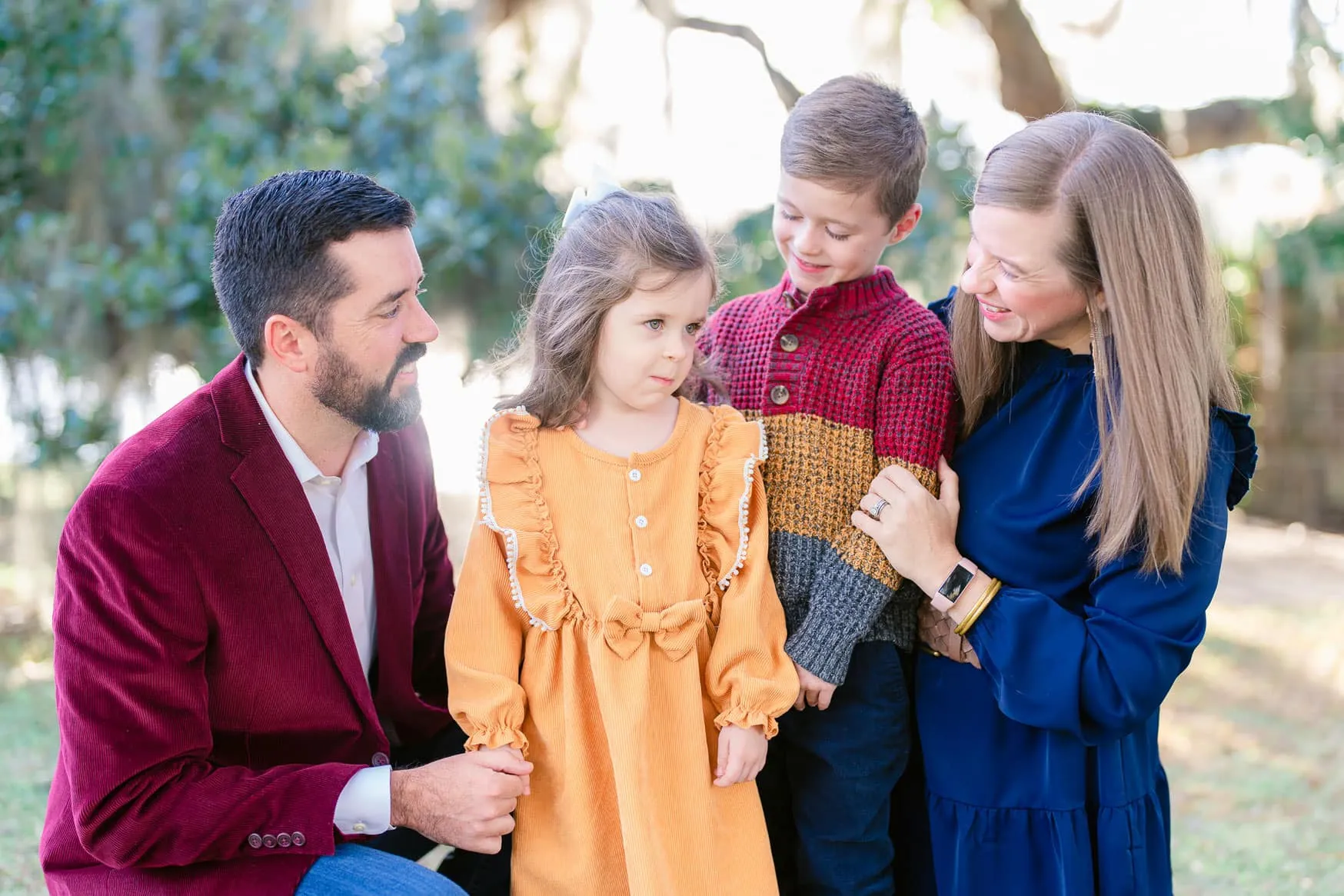 Family photographed outdoors among the trees at Wachesaw in Murrells Inlet