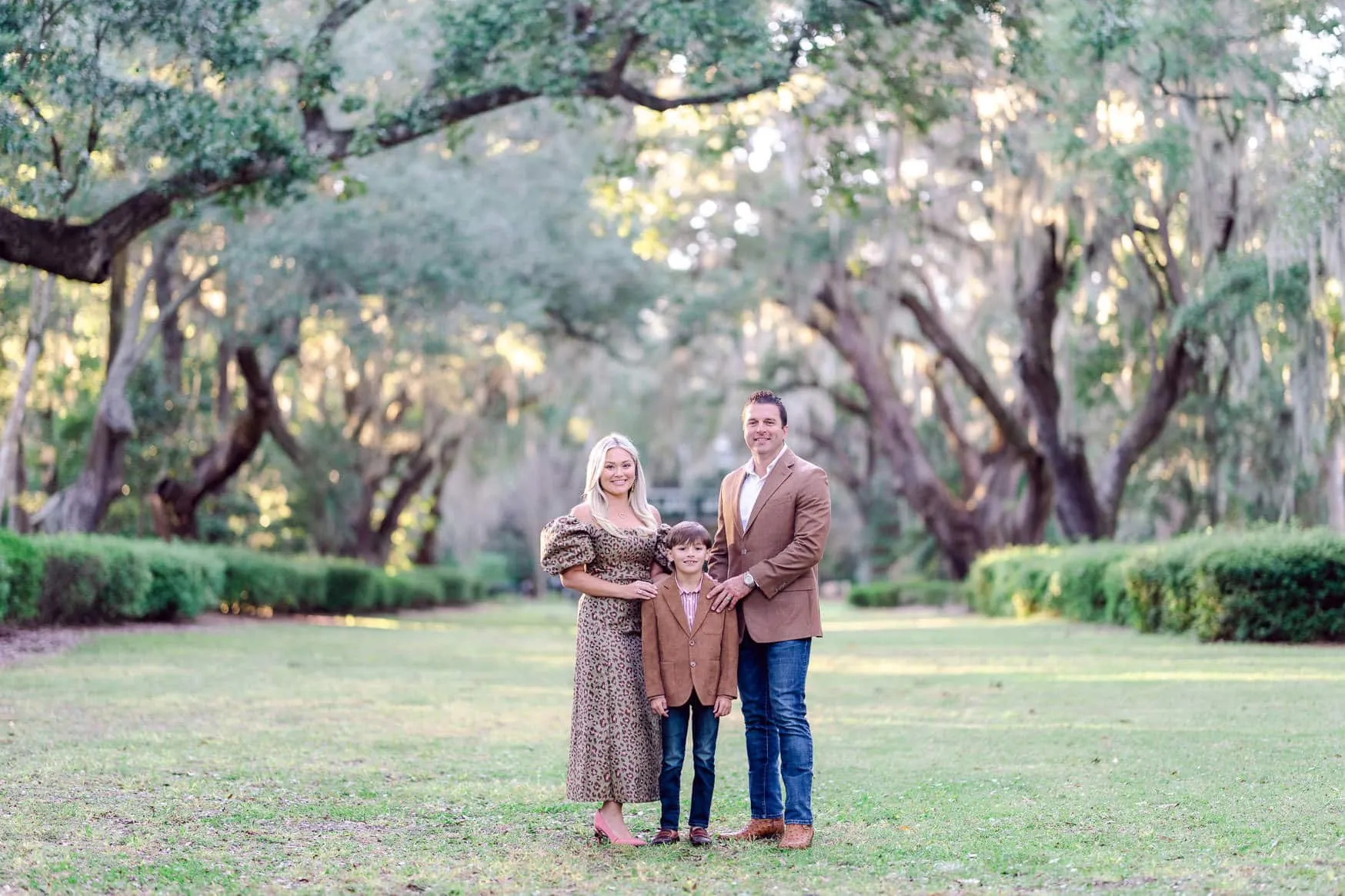 Family portrait beneath live oak trees at Wachesaw in Murrells Inlet