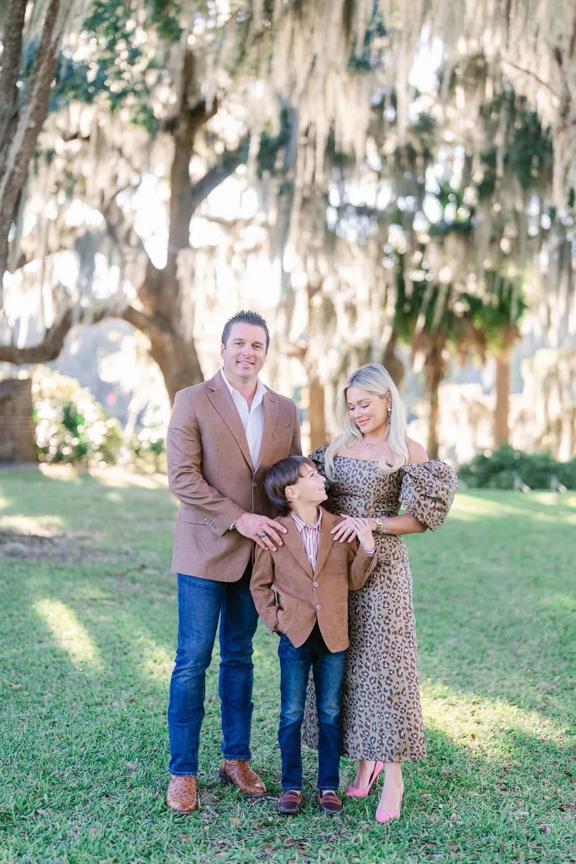 Family portrait on the lawn beneath live oak trees in Murrells Inlet