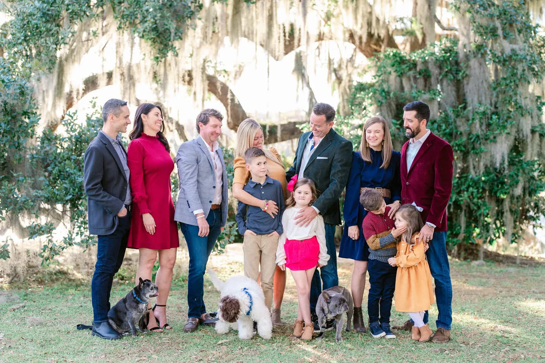 Family portrait surrounded by live oak trees and Spanish moss in Murrells Inlet