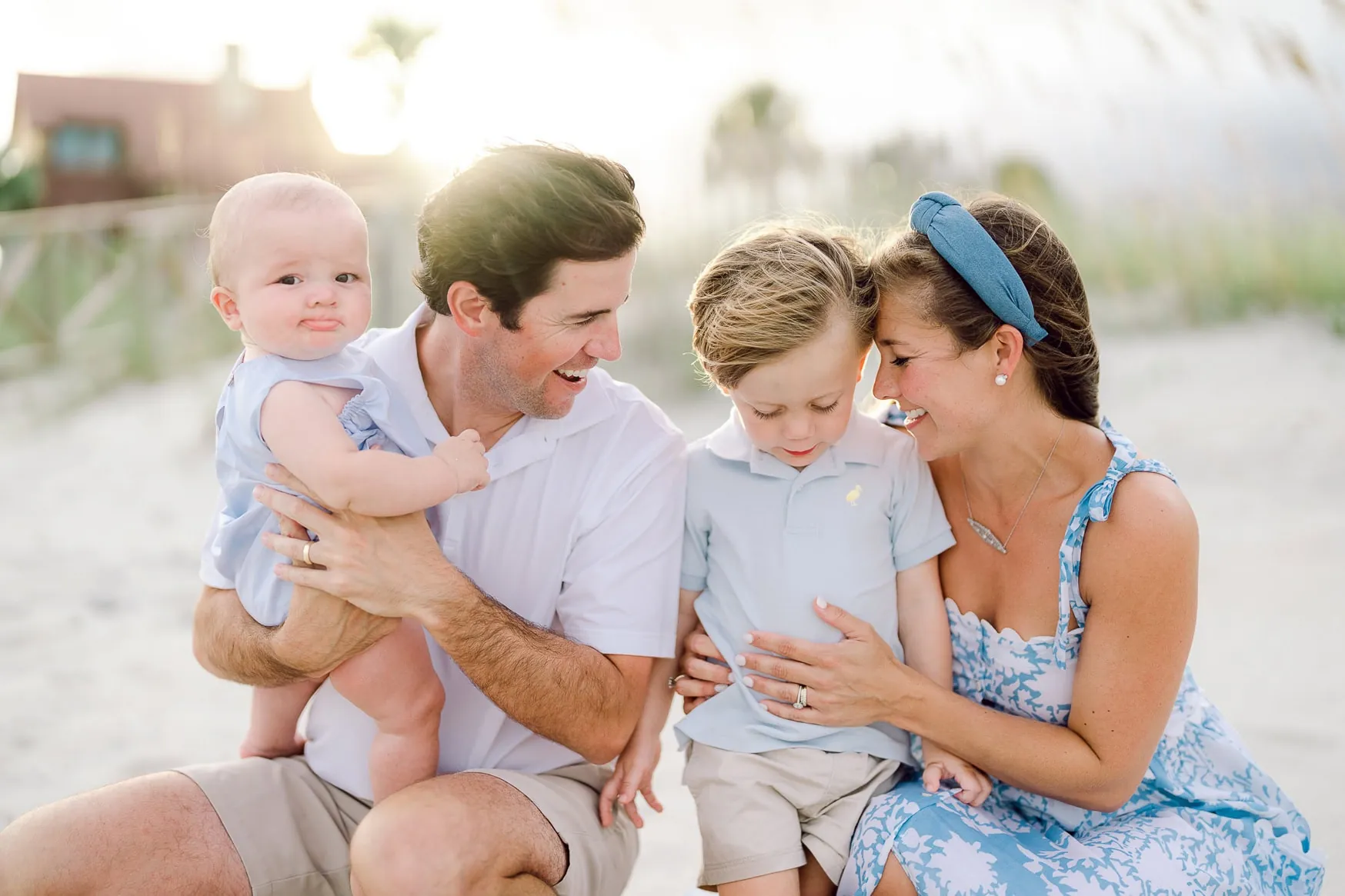 Family wearing coordinated neutral outfits together on Litchfield Beach
