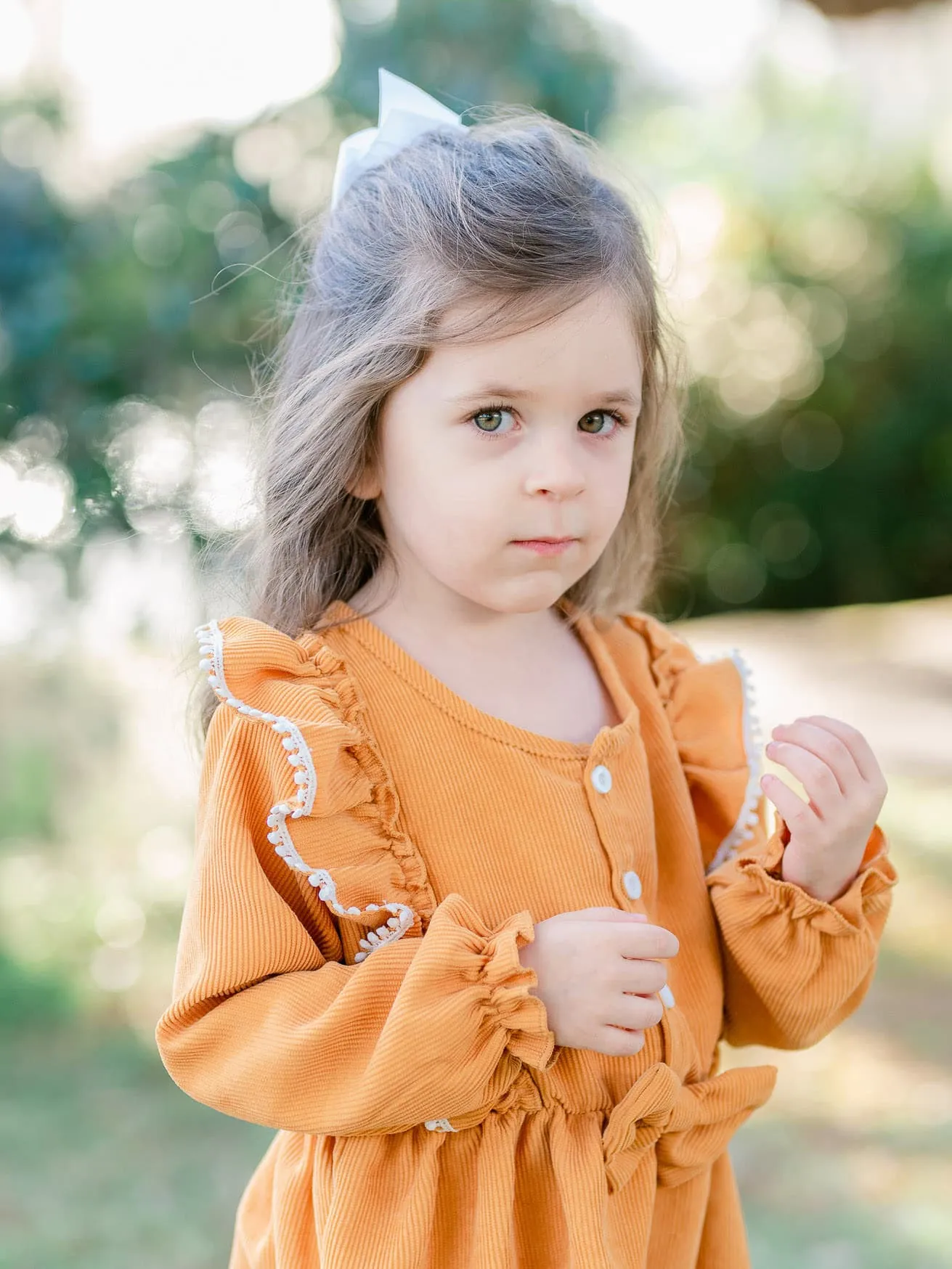 Portrait of a young girl photographed outdoors during a Wachesaw family session