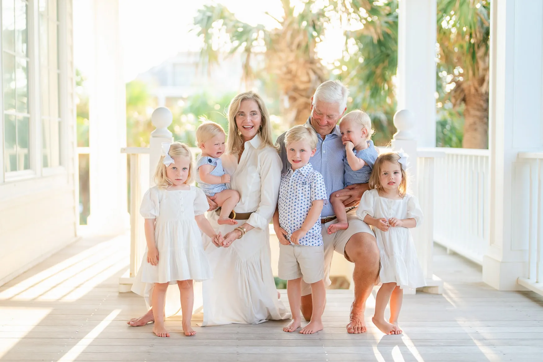 Vibrant family beach portrait featuring multiple generations enjoying sunny outdoor scenery with warm, natural light.