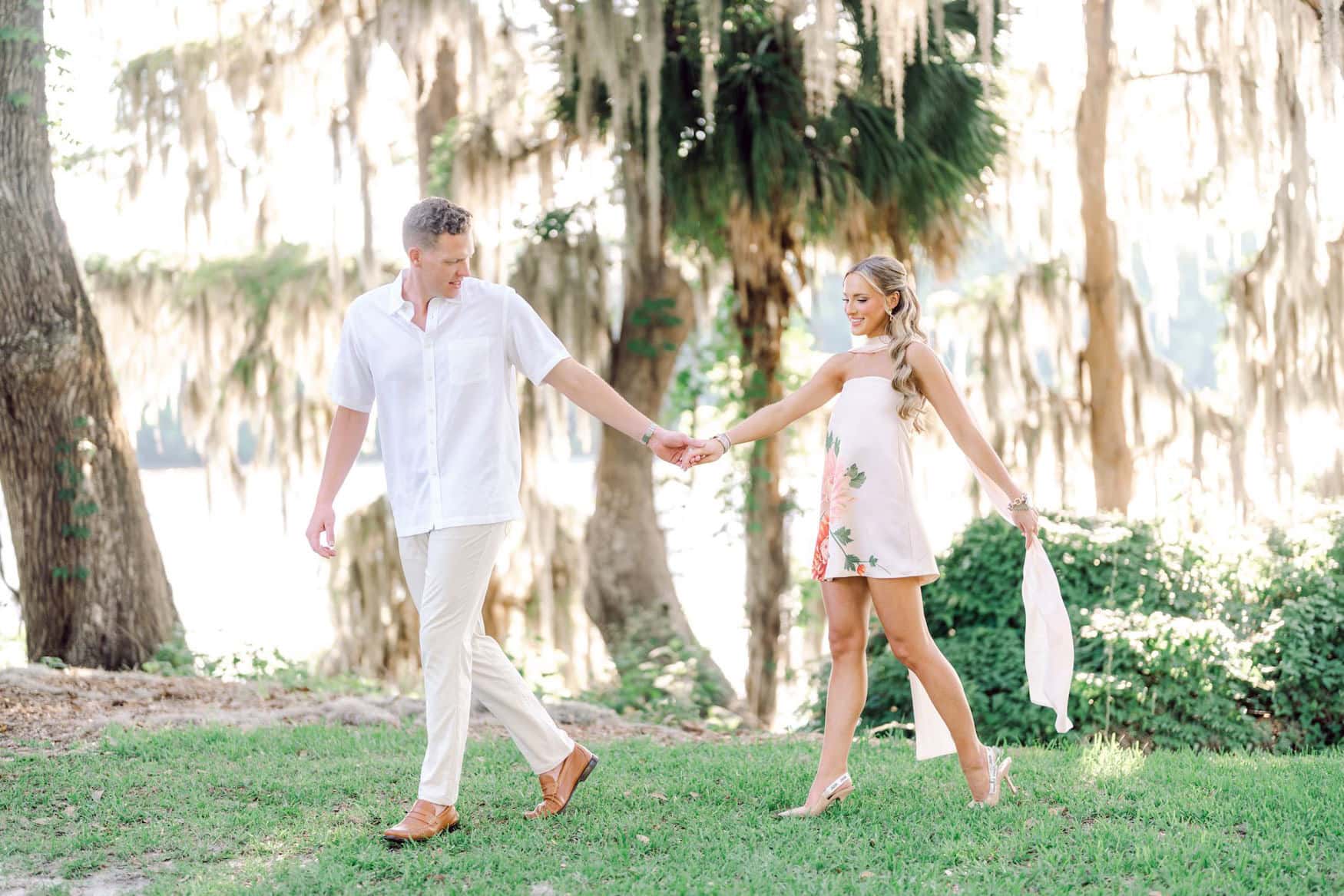 Golden hour light filtering through Spanish moss during a Pawleys Island engagement session by Pasha Belman Photography