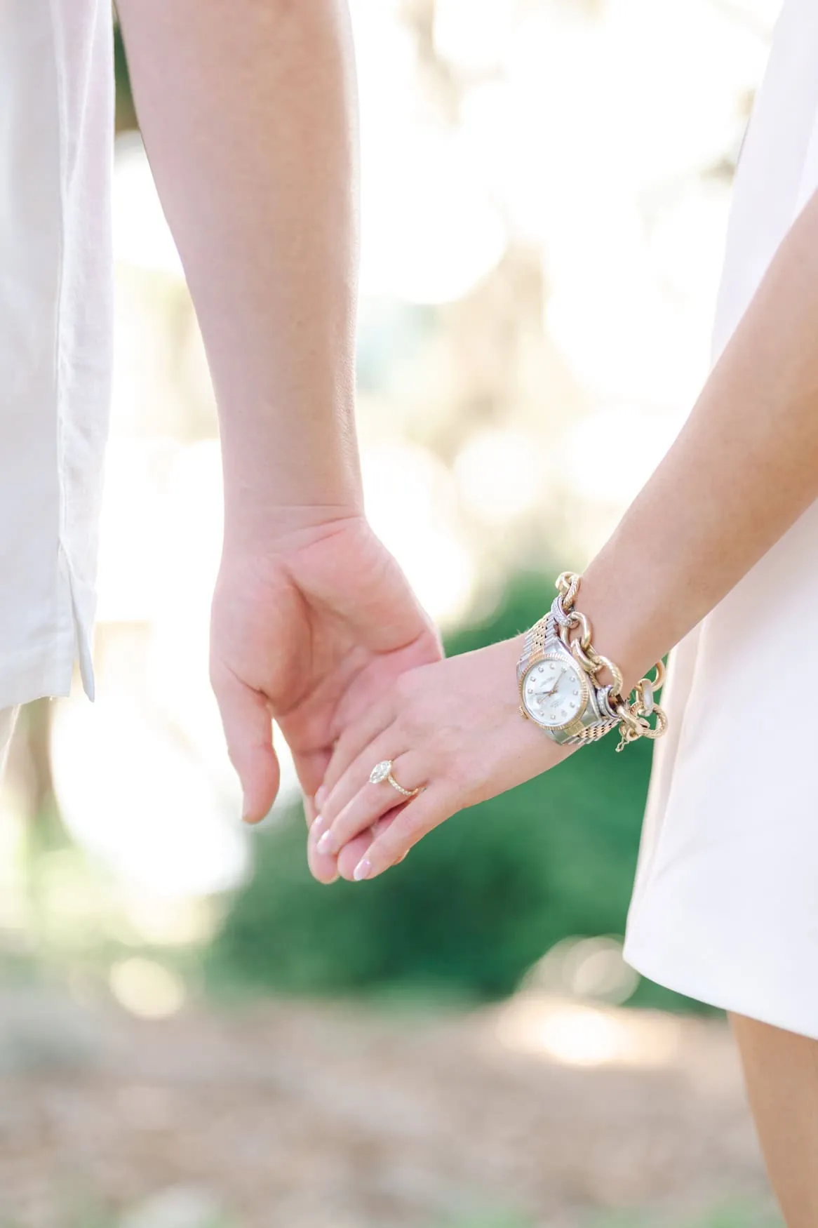 Close portrait of engaged woman smiling with ring visible during Pawleys Island SC engagement session