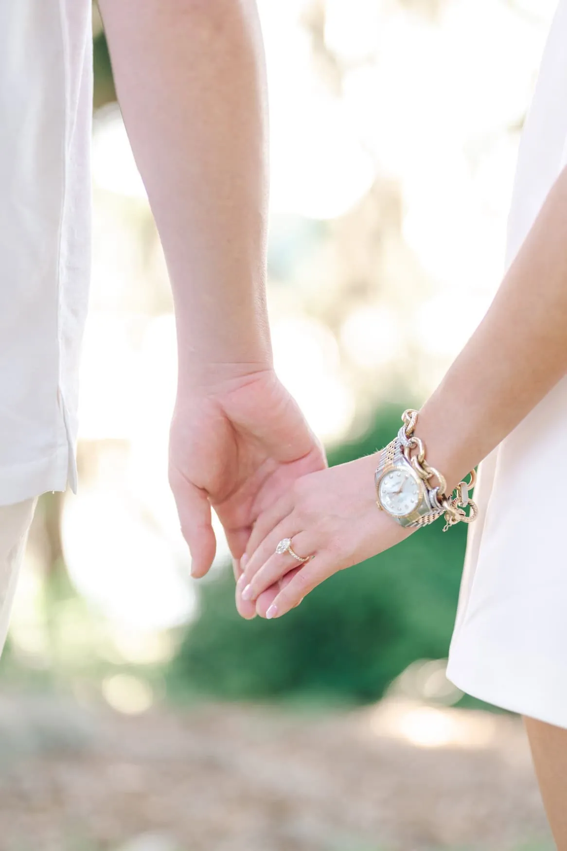 Couple posing under Spanish moss during their Pawleys Island South Carolina engagement session