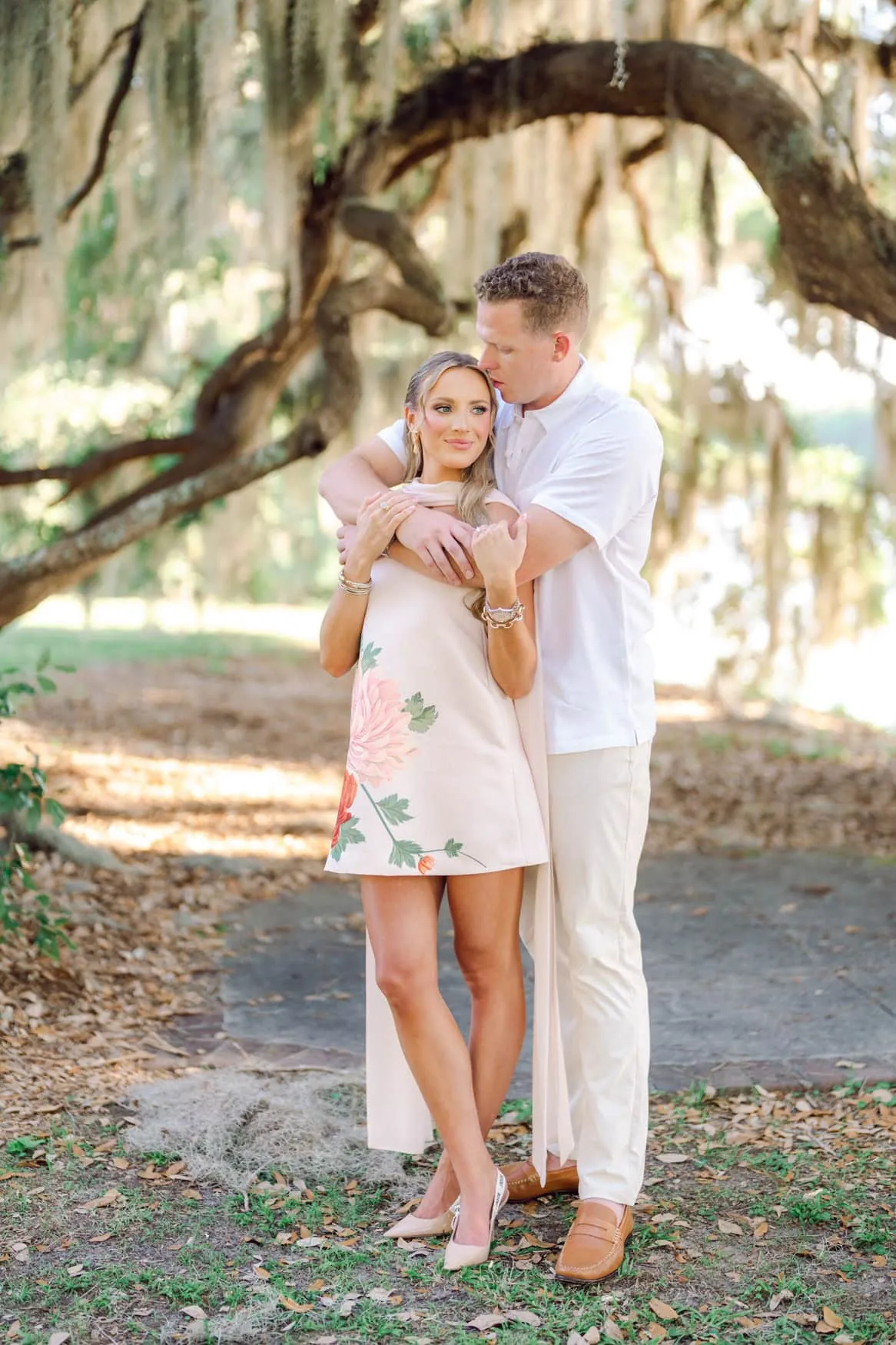 Natural candid moment between engaged couple during their Pawleys Island SC session photographed by Pasha Belman