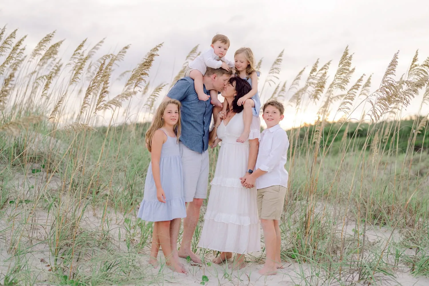 Family accessorized with simple, delicate jewelry for beach family photos in Myrtle Beach, South Carolina.