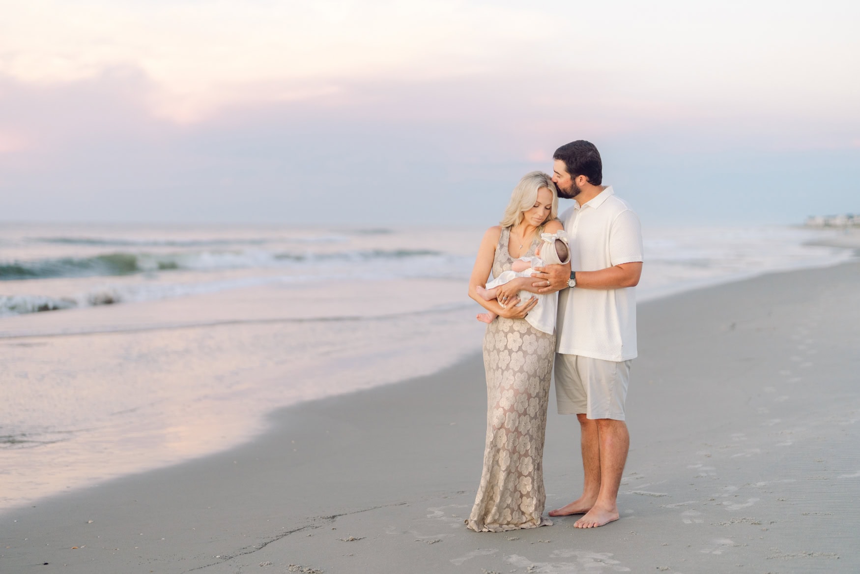 Family walking together during a sunrise session in Pawleys Island