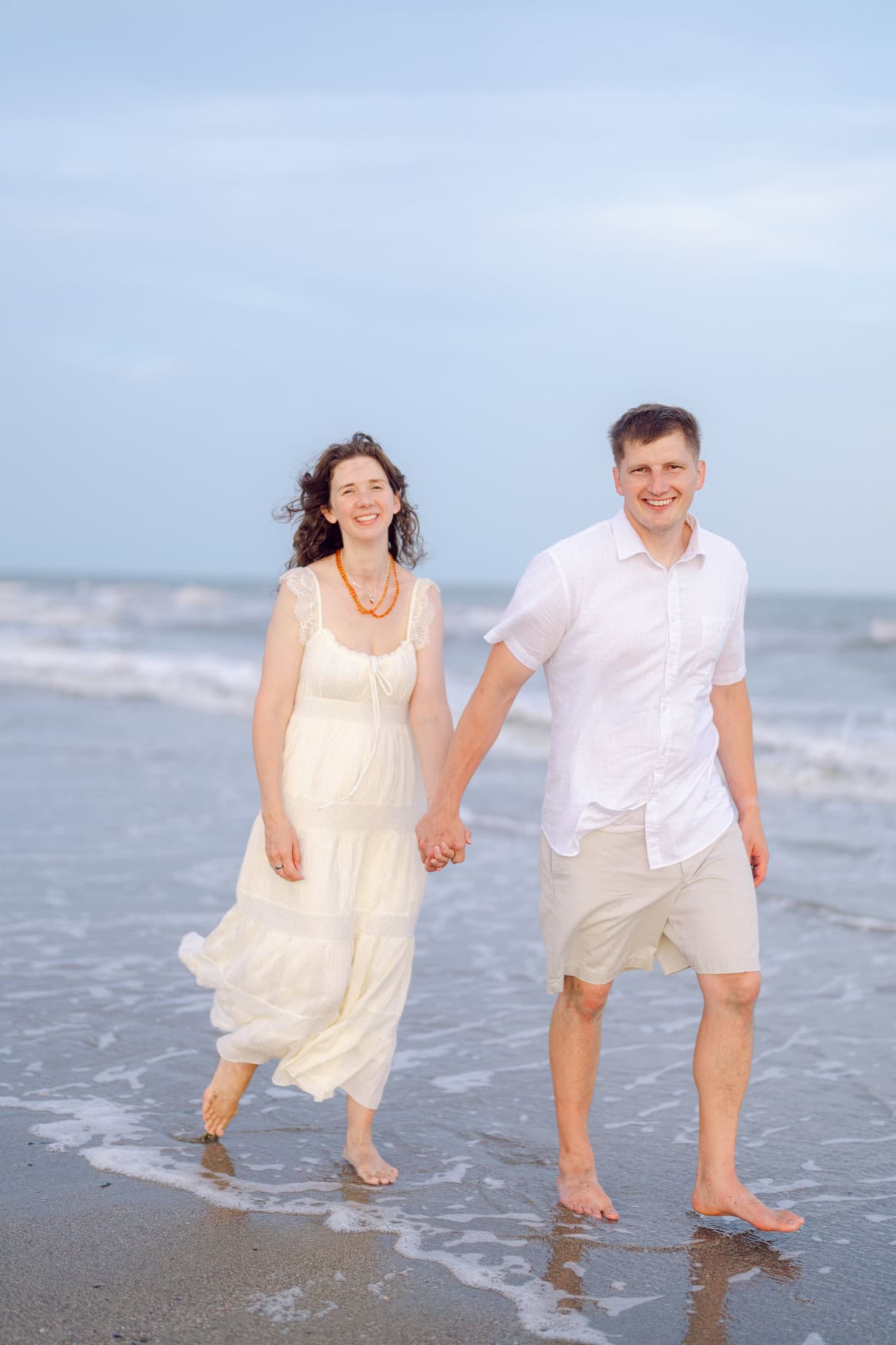 Extended family during beach portraits at Wild Dunes Resort