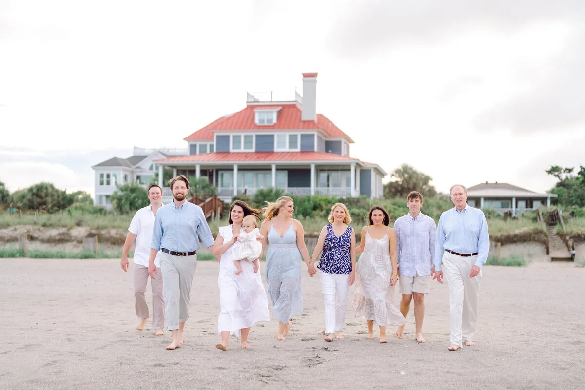 Family walking toward a beach house at DeBordieu Colony in Georgetown SC
