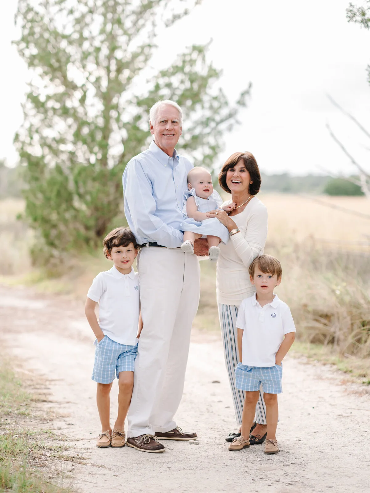 Grandparents and grandchildren on a dune path at DeBordieu Beach