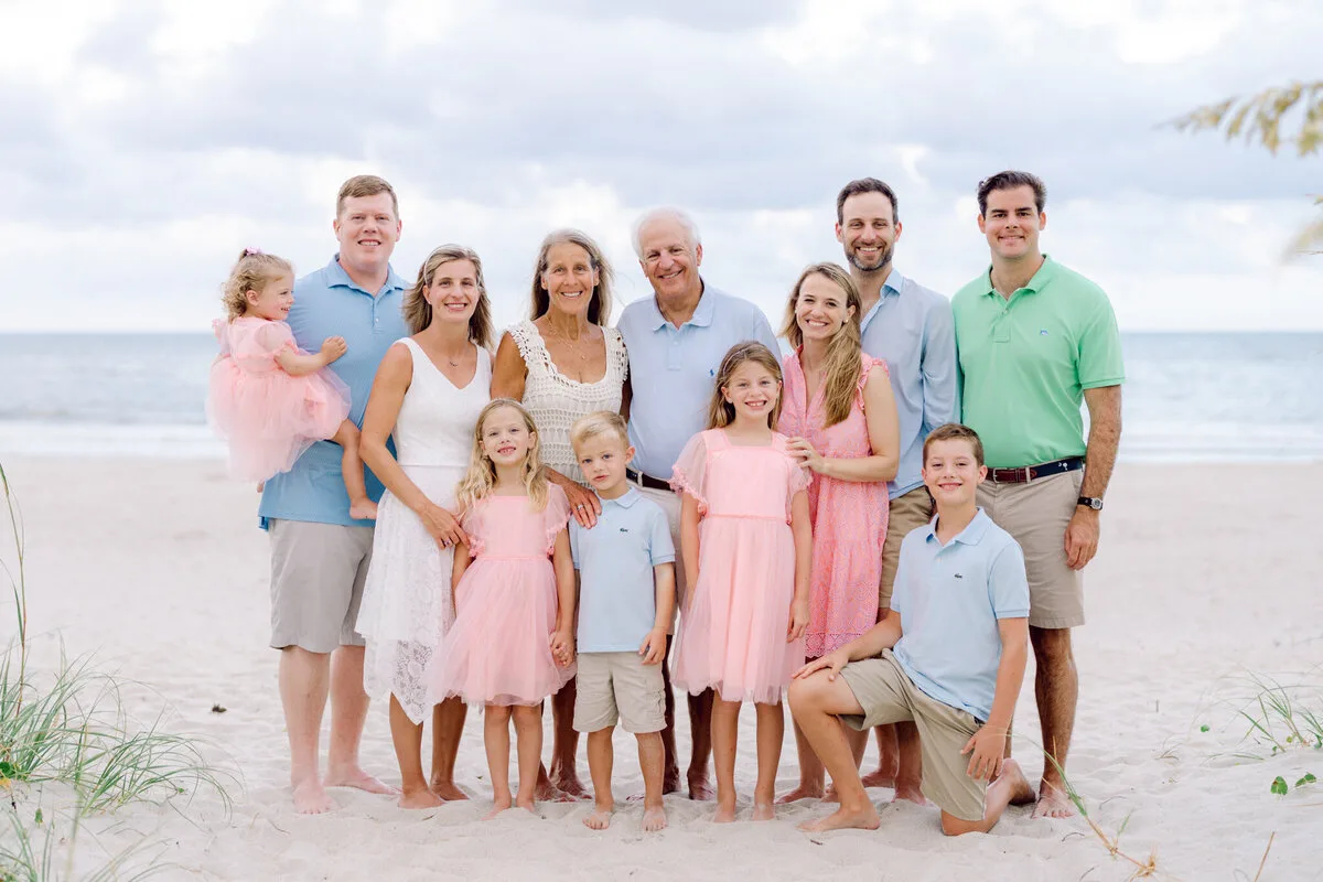 Large family in pink and blue on DeBordieu Beach in Georgetown SC