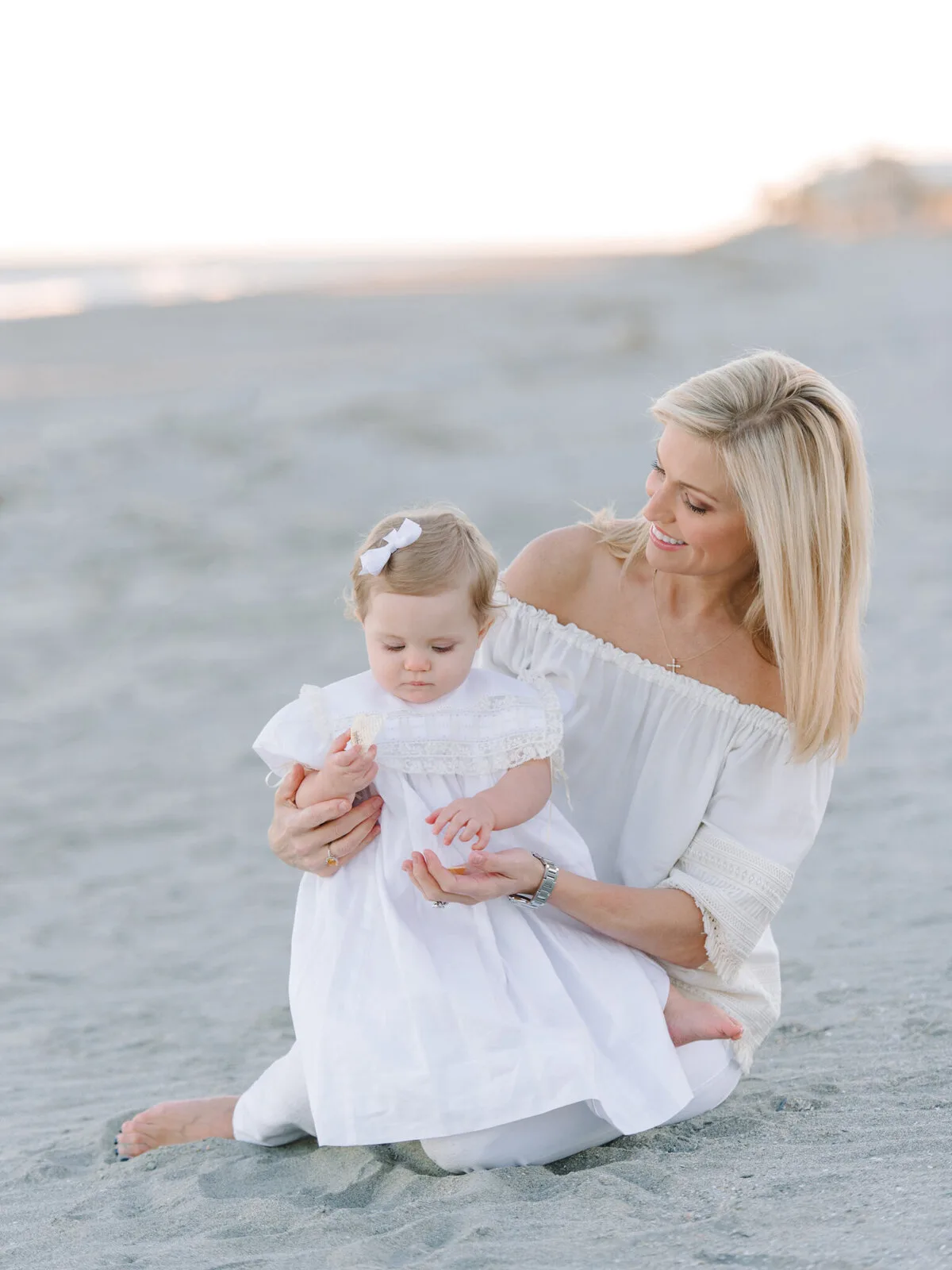 Mother and baby girl on the sand at DeBordieu Beach