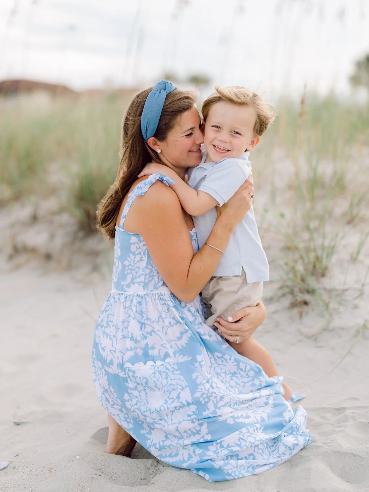 Mother and toddler in the sea oats at DeBordieu Beach in Georgetown SC